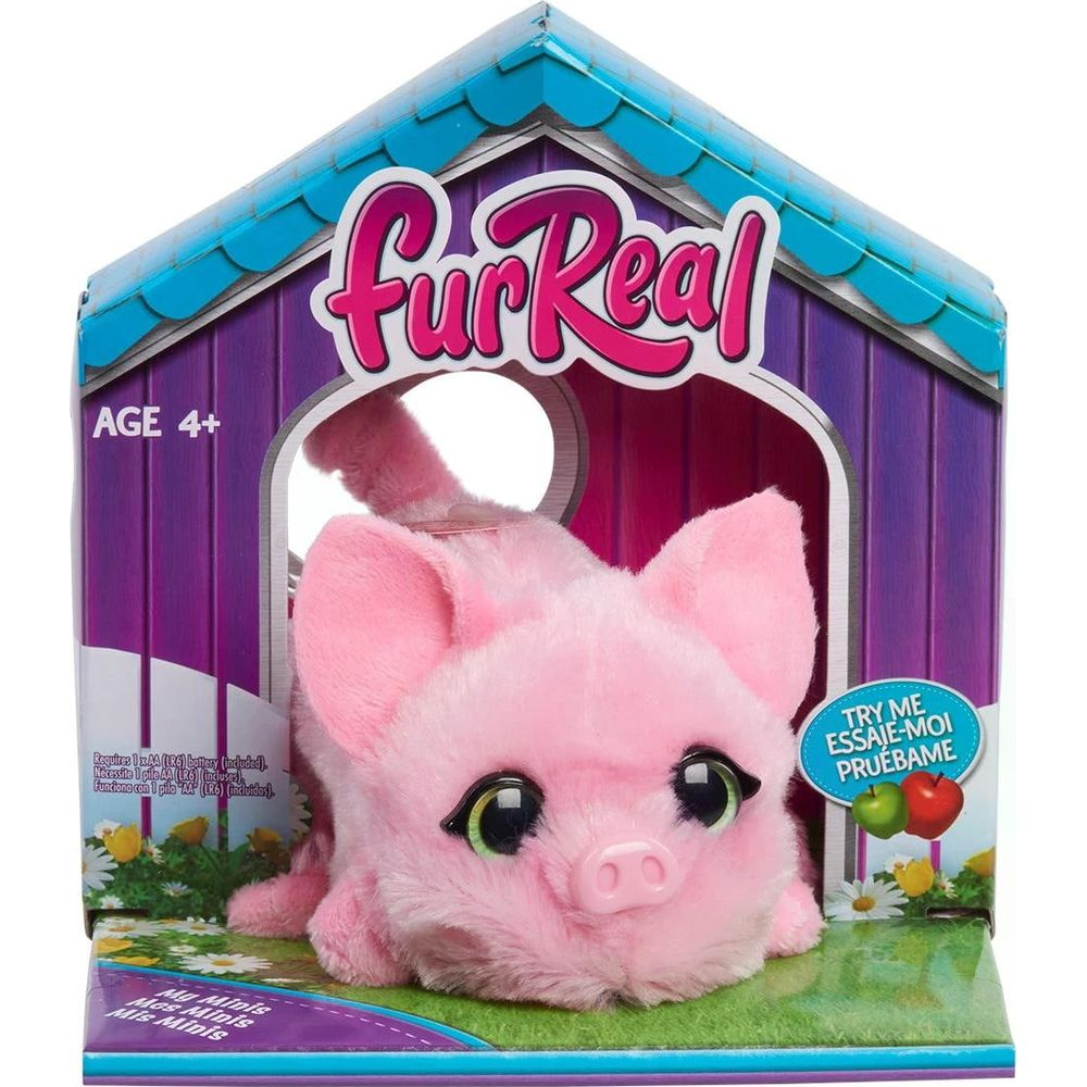Un jouet cochon en peluche rose dans une boîte colorée "furReal", pour les 4 ans et plus.