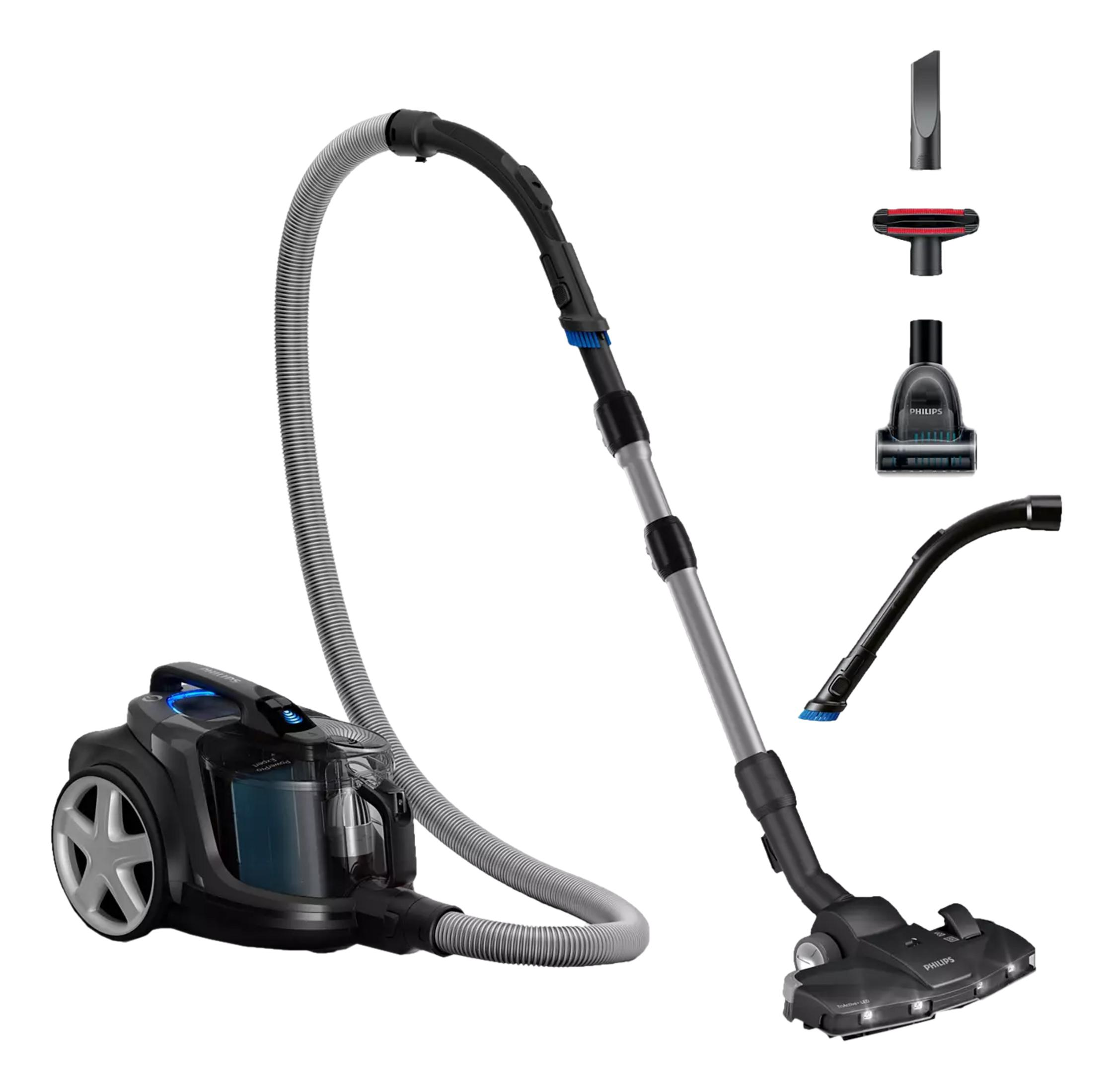 Aspirateur noir avec accessoires : brosse de sol, tuyau, tube et embouts brosse.