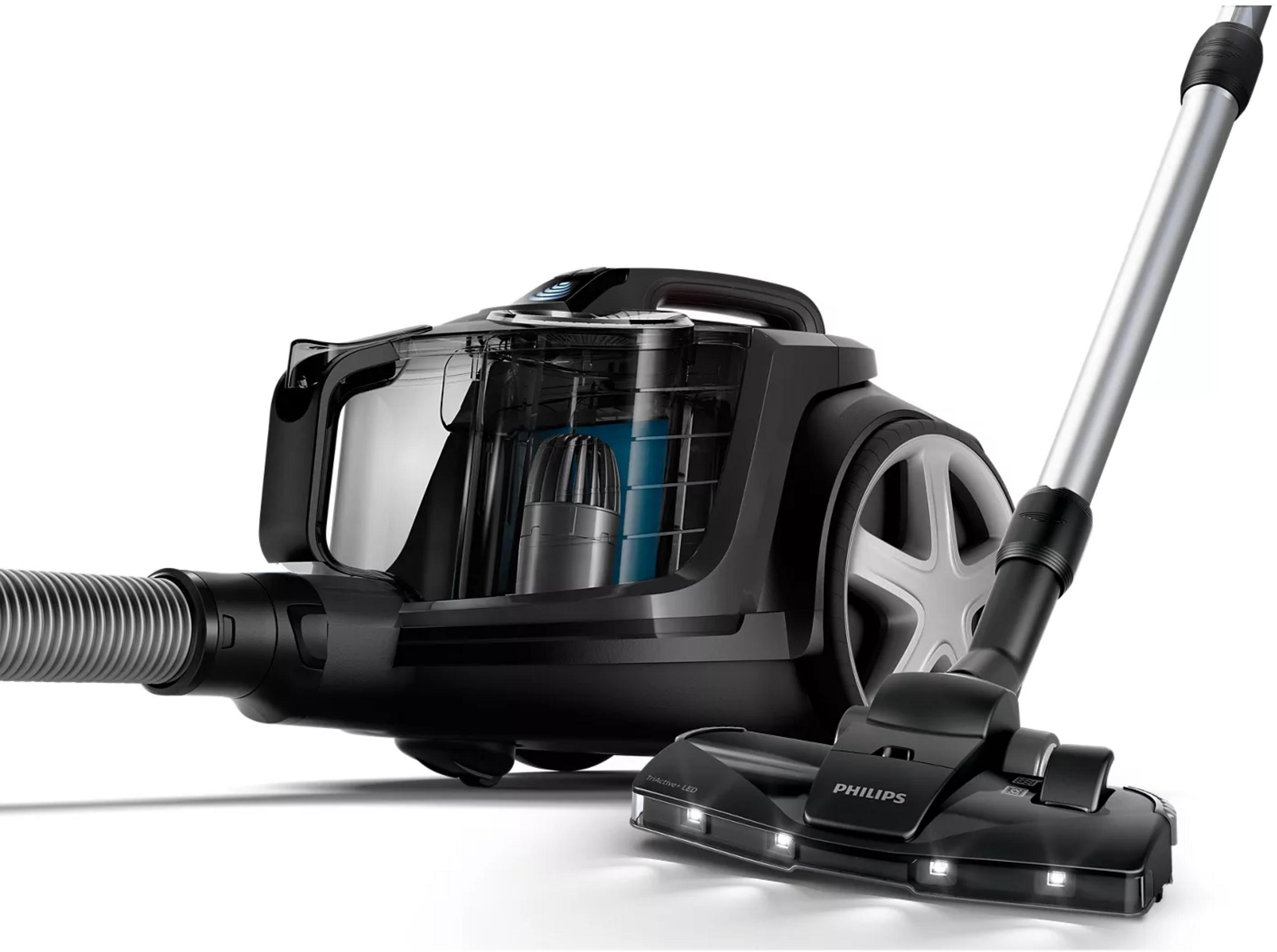 Aspirateur noir avec bac transparent et tête de brosse LED.