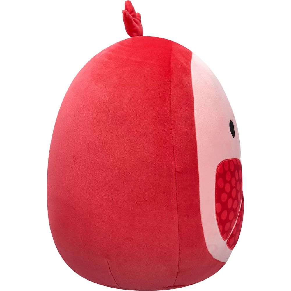 Un jouet en peluche rouge en forme d'œuf avec une tige verte sur le dessus.