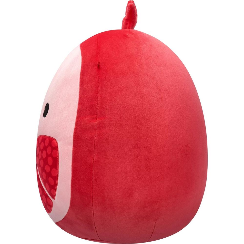 Une peluche rouge en forme d'œuf avec une petite crête rouge sur le dessus.