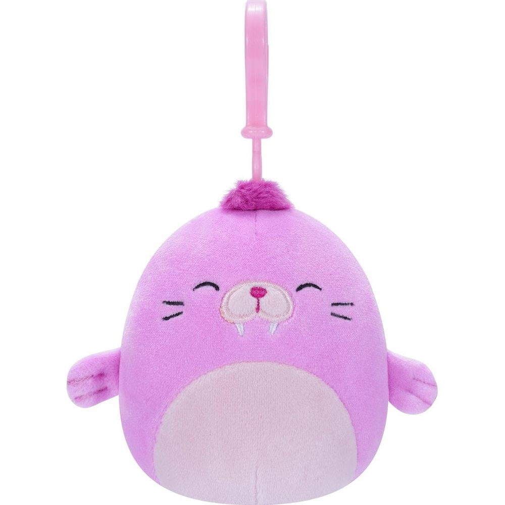 Un phoque en peluche violet avec un clip rose.