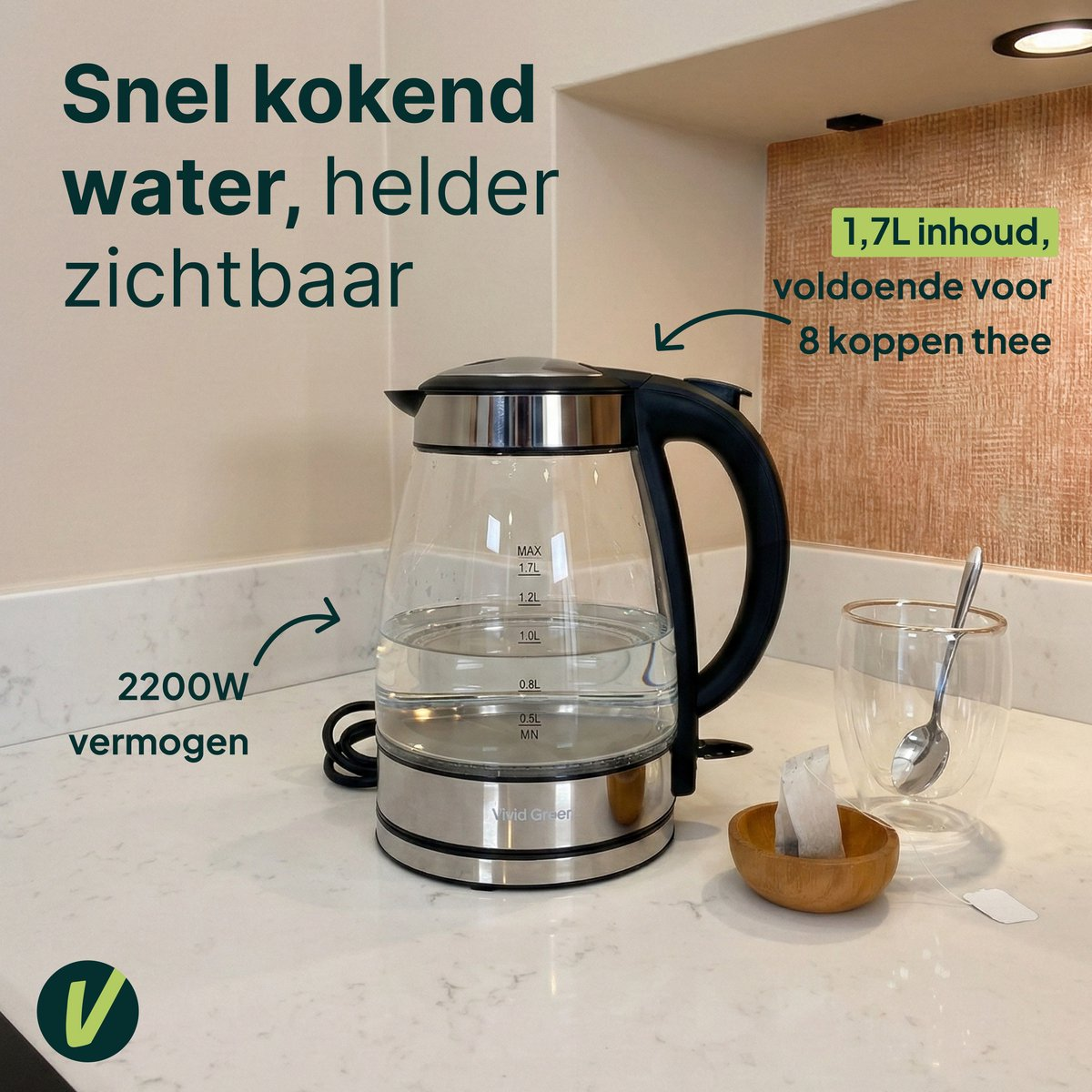 A clear glass kettle with 1.7L capacity sits on a marble countertop.