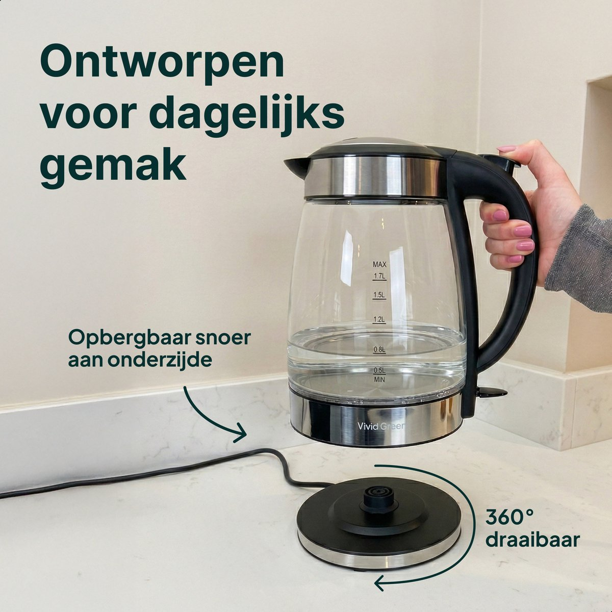 A glass kettle with a black handle and cord is shown. It has a 360° base.