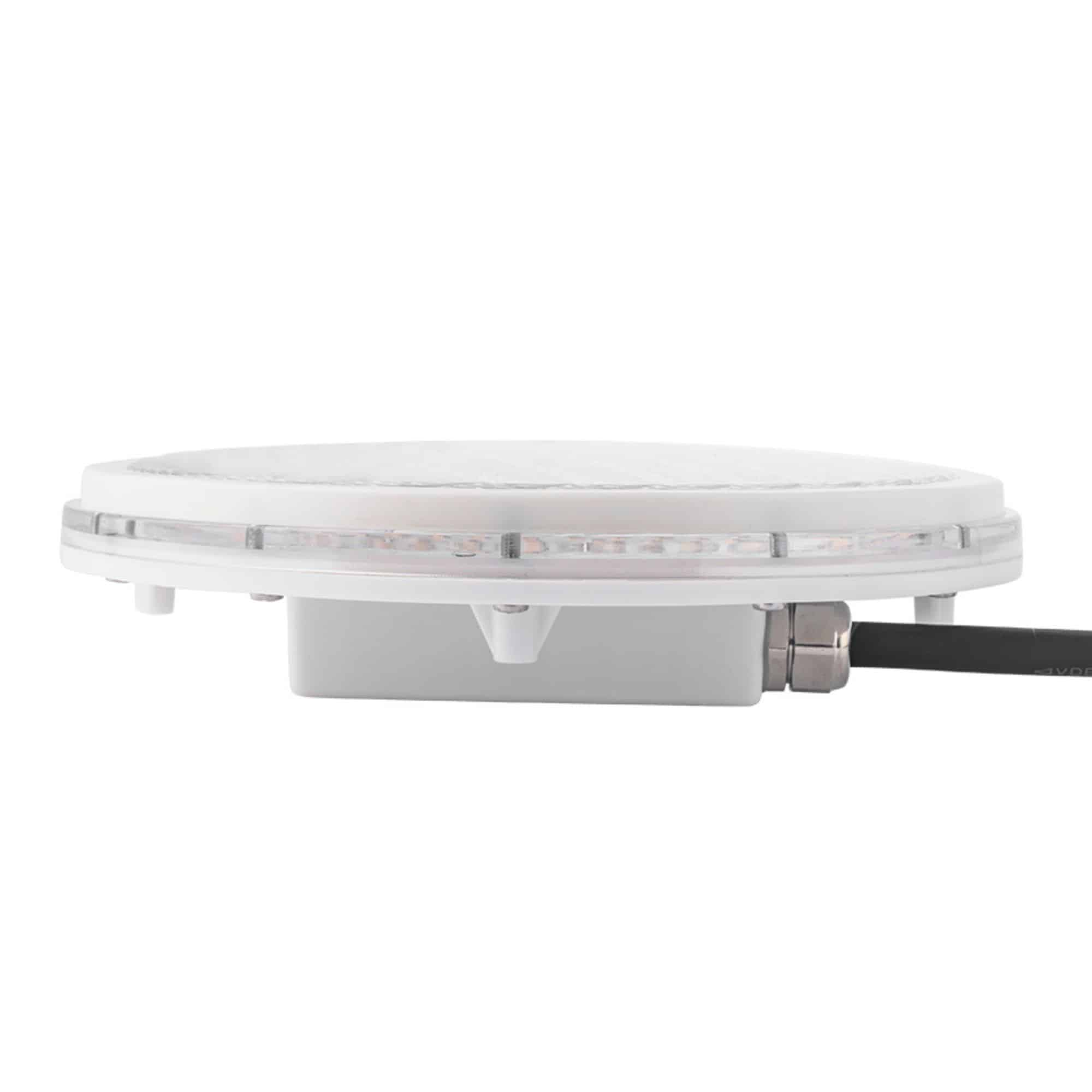 Un dispositivo blanco y redondo con LEDs y un conector de cable.