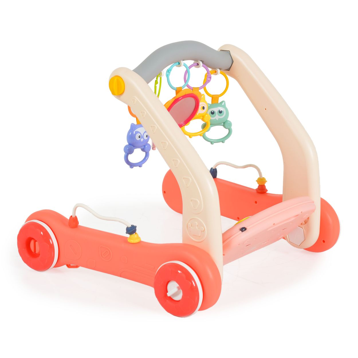 Ein bunter Lauflernwagen mit Spielzeug, darunter Eulen und Ringe.
