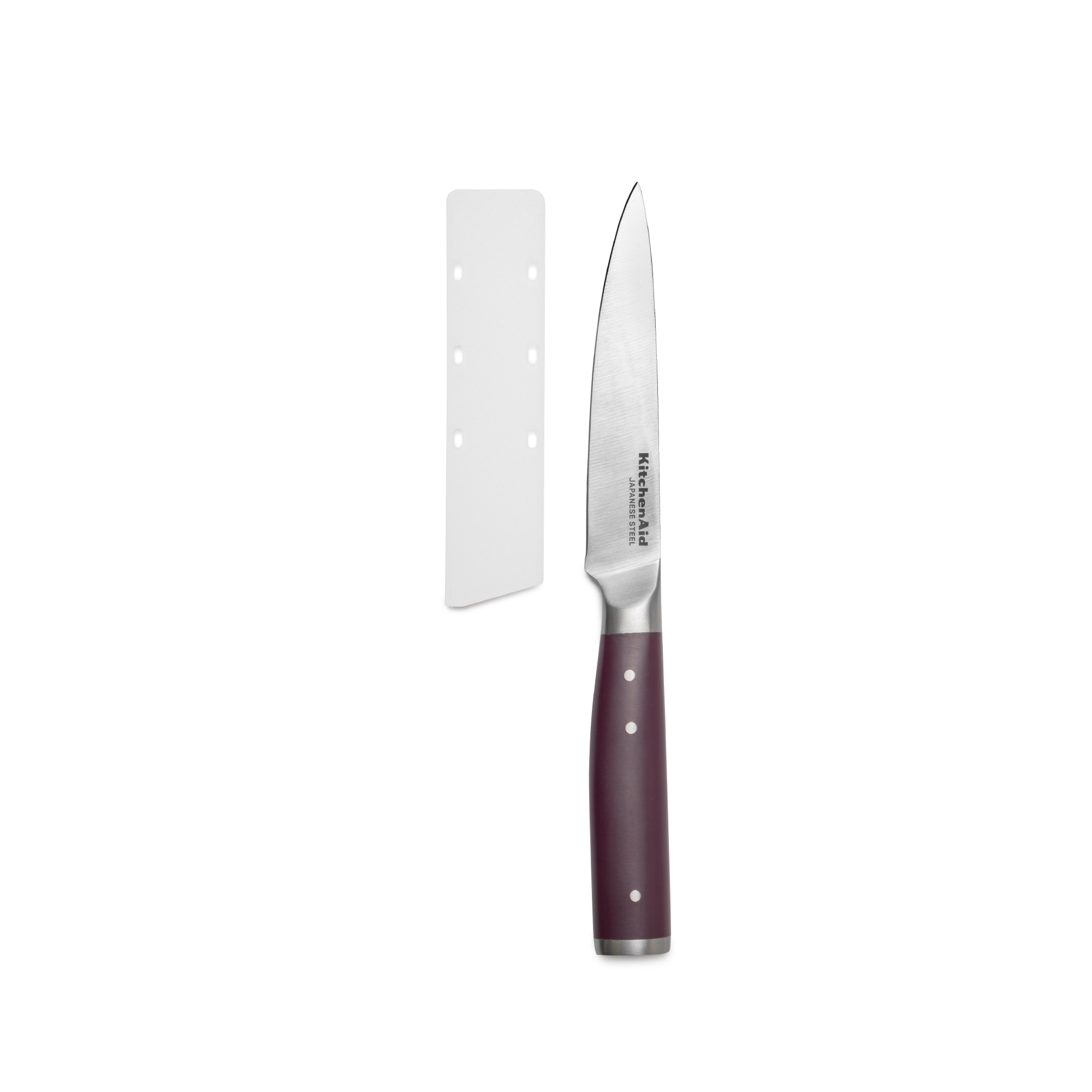 Ein KitchenAid Messer mit dunkelrotem Griff liegt neben einer Schutzhülle.