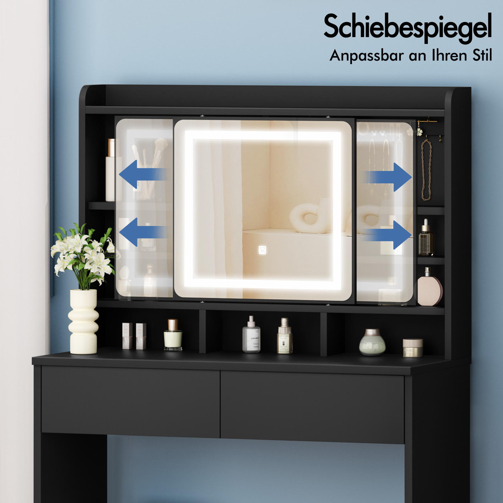 Schwarzer Schminktisch mit beleuchtetem Spiegel und Schubladen. Dekoriert mit Blumen und Kosmetik.