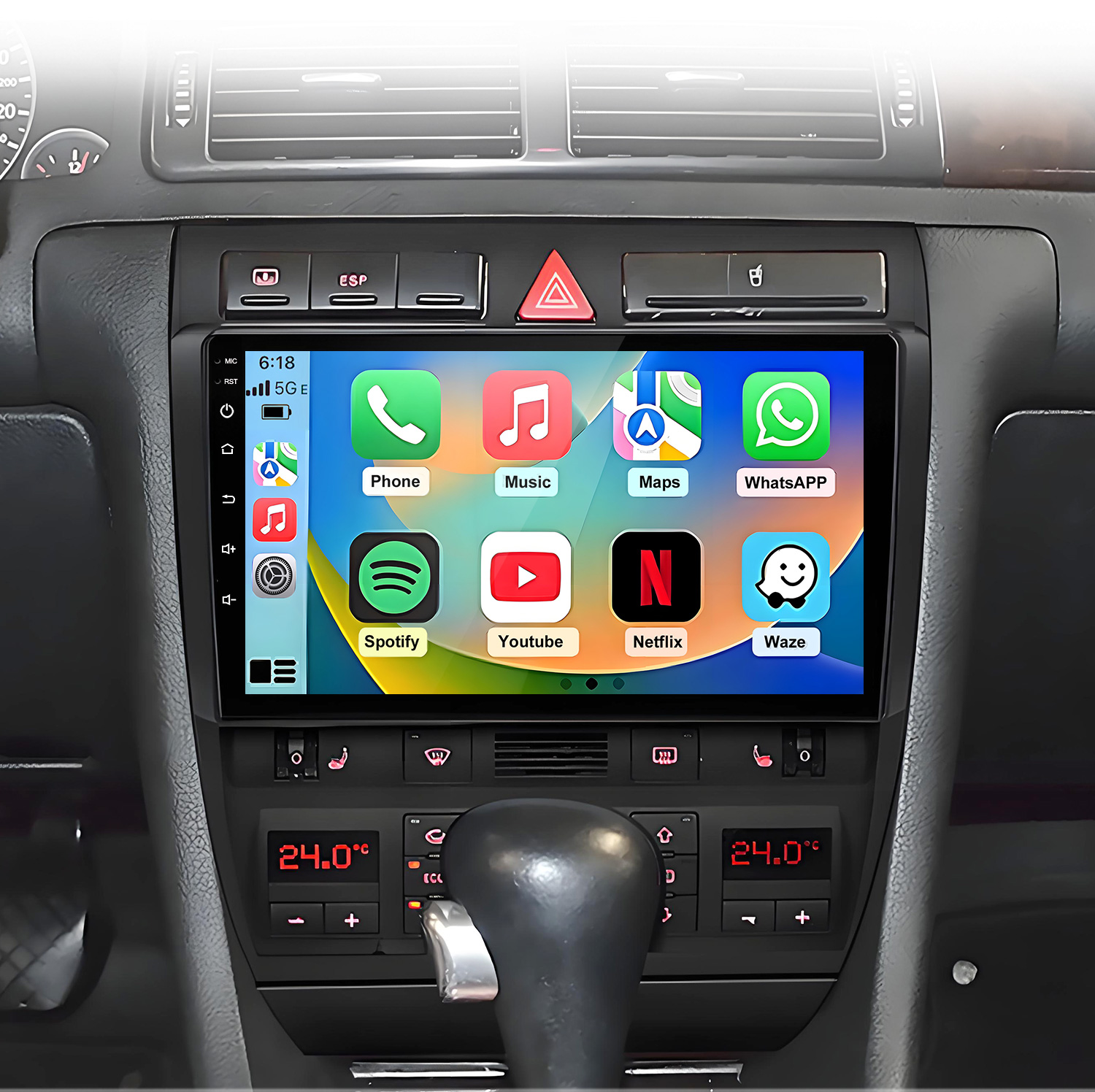 System infotainmentu samochodowego z ikonami aplikacji, wyświetlaczem klimatu i dźwignią biegów.