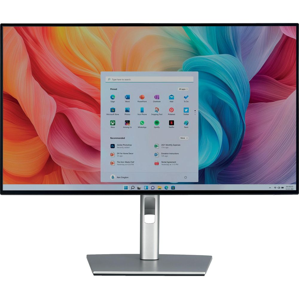 Un monitor desktop moderno con uno sfondo colorato e il menu Start di Windows 11.