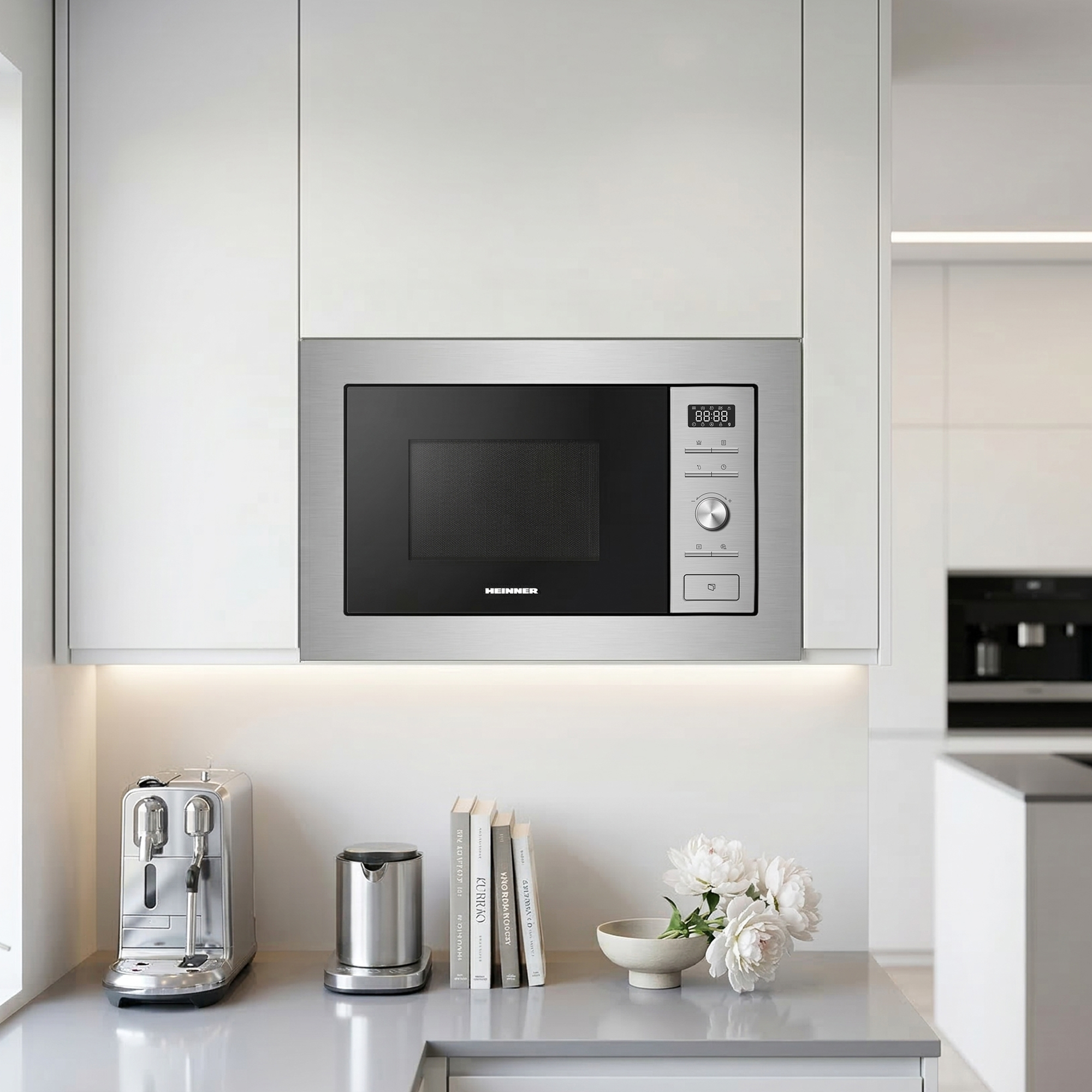 A built-in microwave oven with a stainless steel finish and digital display.