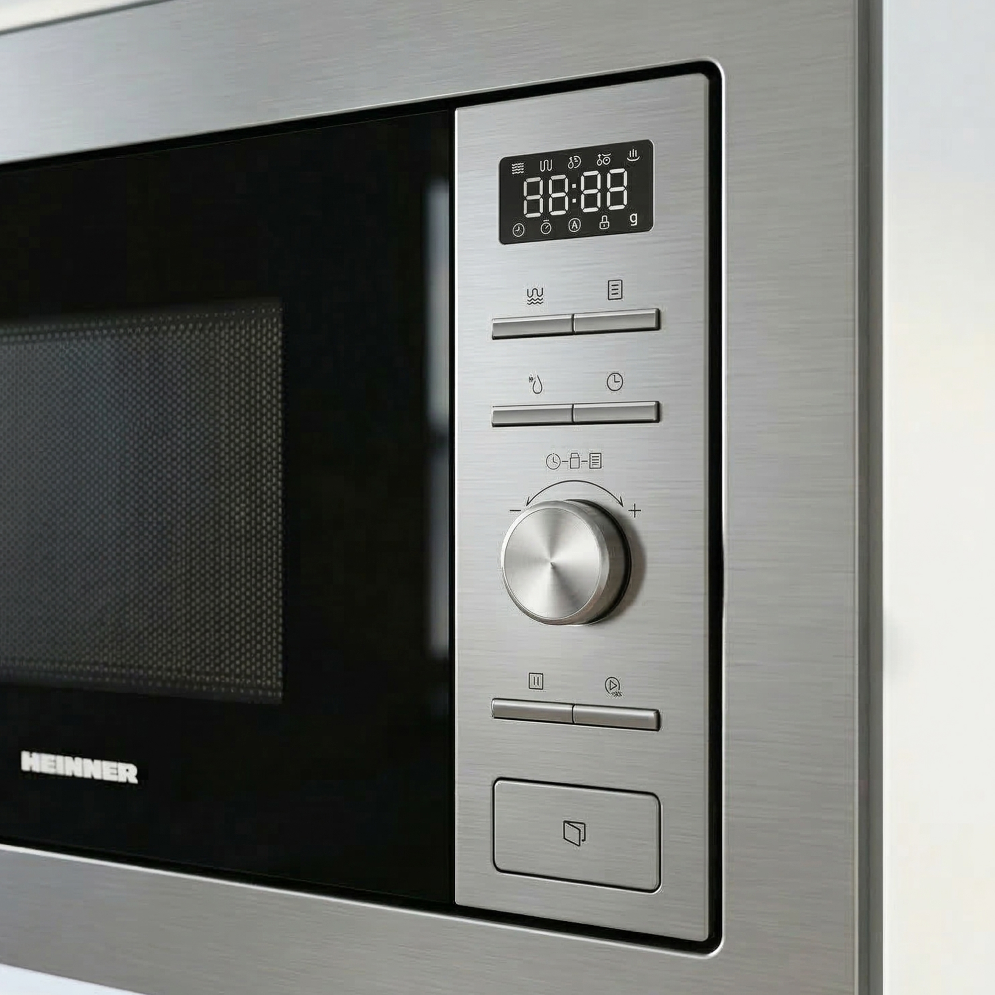 Built-in microwave with digital display and rotary knob.