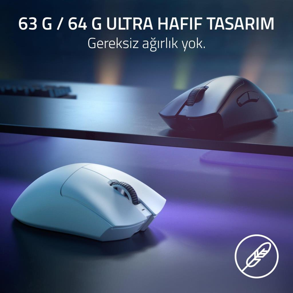 Mor aydınlatmalı karanlık yüzeyde iki bilgisayar faresi, biri beyaz, diğeri siyah.