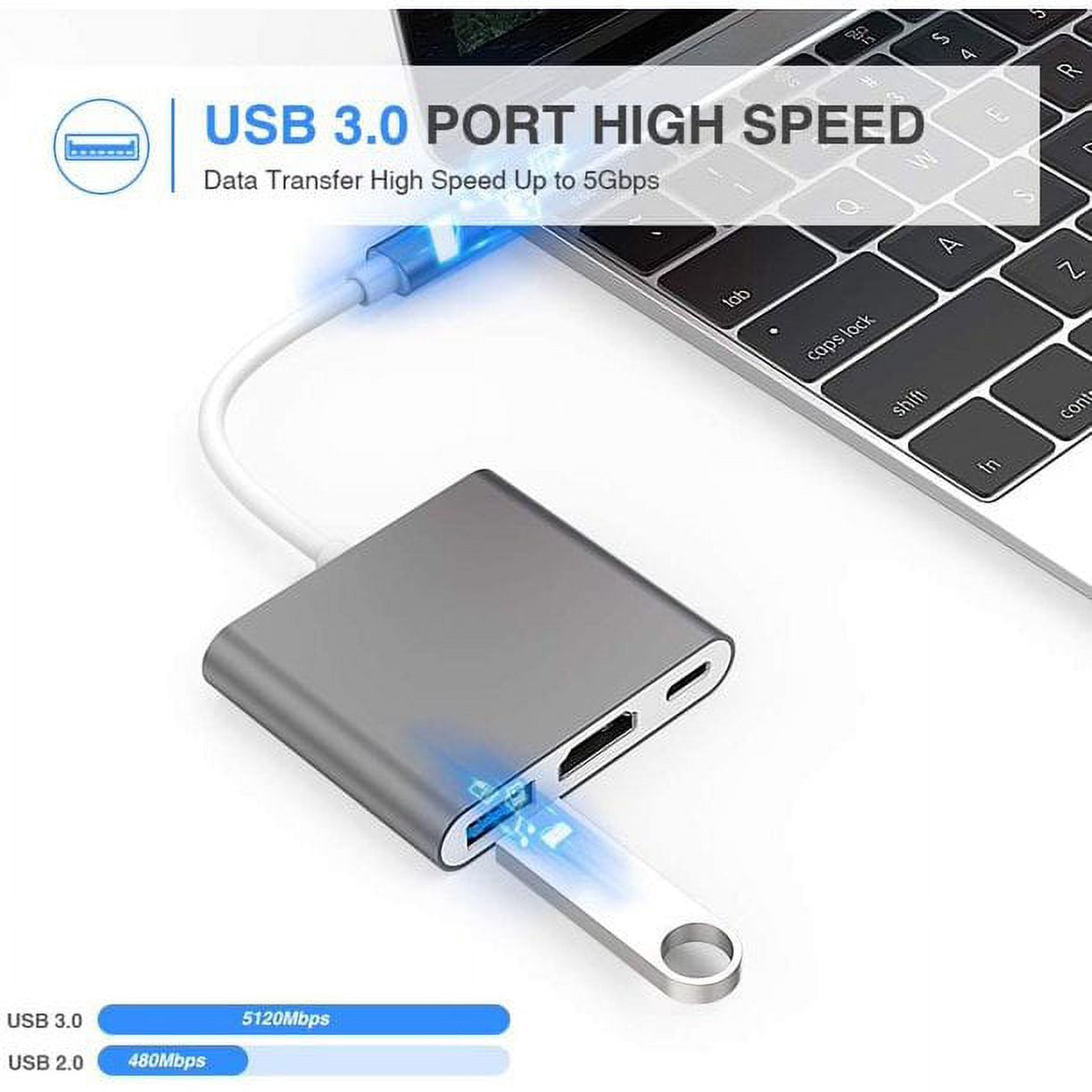 Grauer USB-C-Hub mit angeschlossenem USB-Stick, neben einer Tastatur.