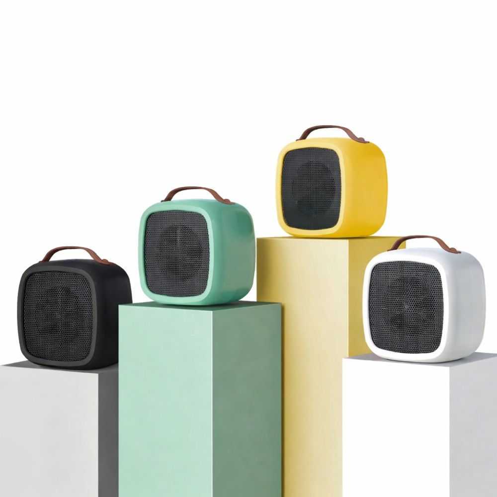 Cuatro calefactores pequeños en negro, verde, amarillo y blanco sobre pedestales.