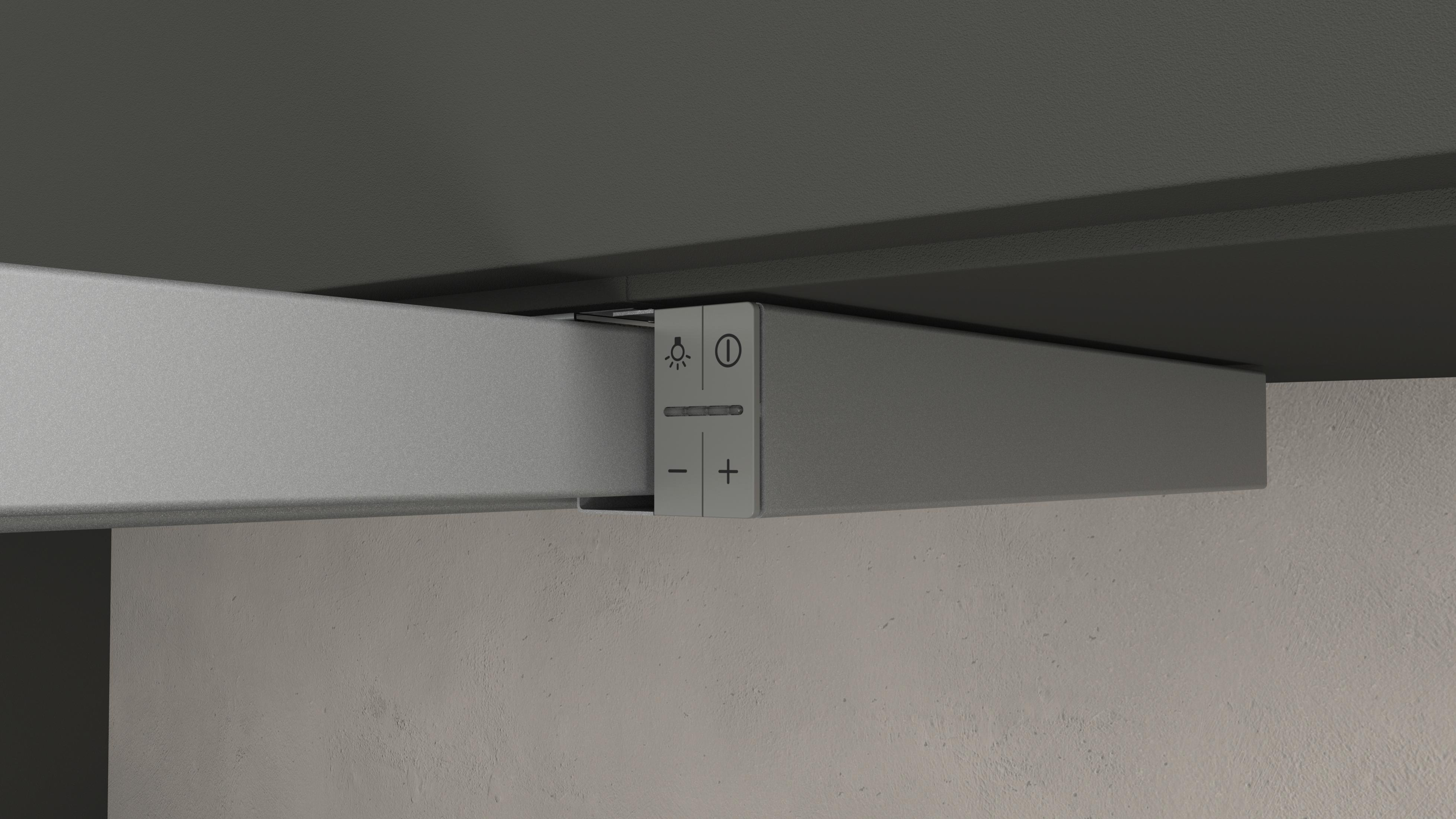 Ein grauer Bedienknopf mit Licht- und Ein/Aus-Symbolen und Plus/Minus-Tasten.