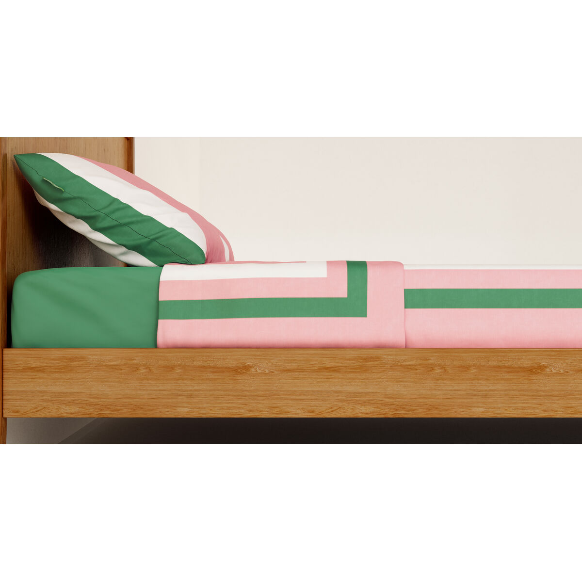 Una cama con sábana verde, edredón a rayas y almohada.
