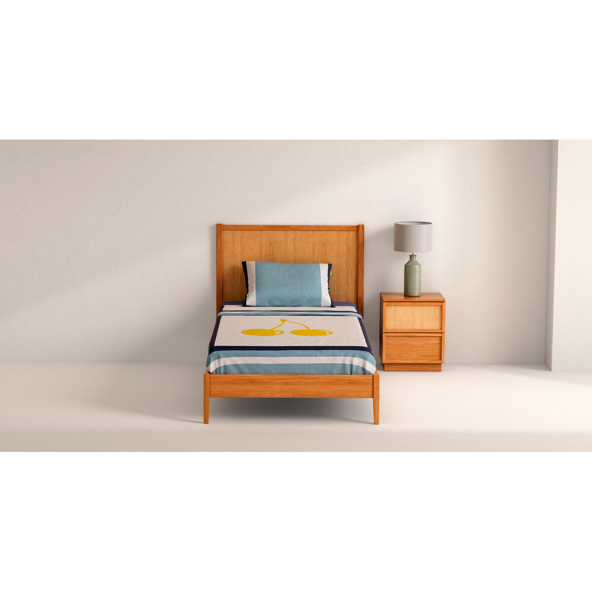 Una cama individual con marco de madera, almohada azul y ropa de cama con cerezas.