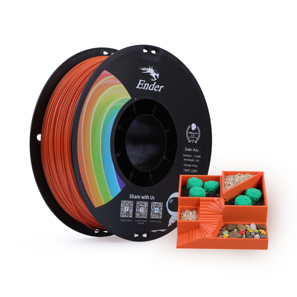 Yanında küçük turuncu bir model bulunan turuncu 3D yazıcı filament makarası.