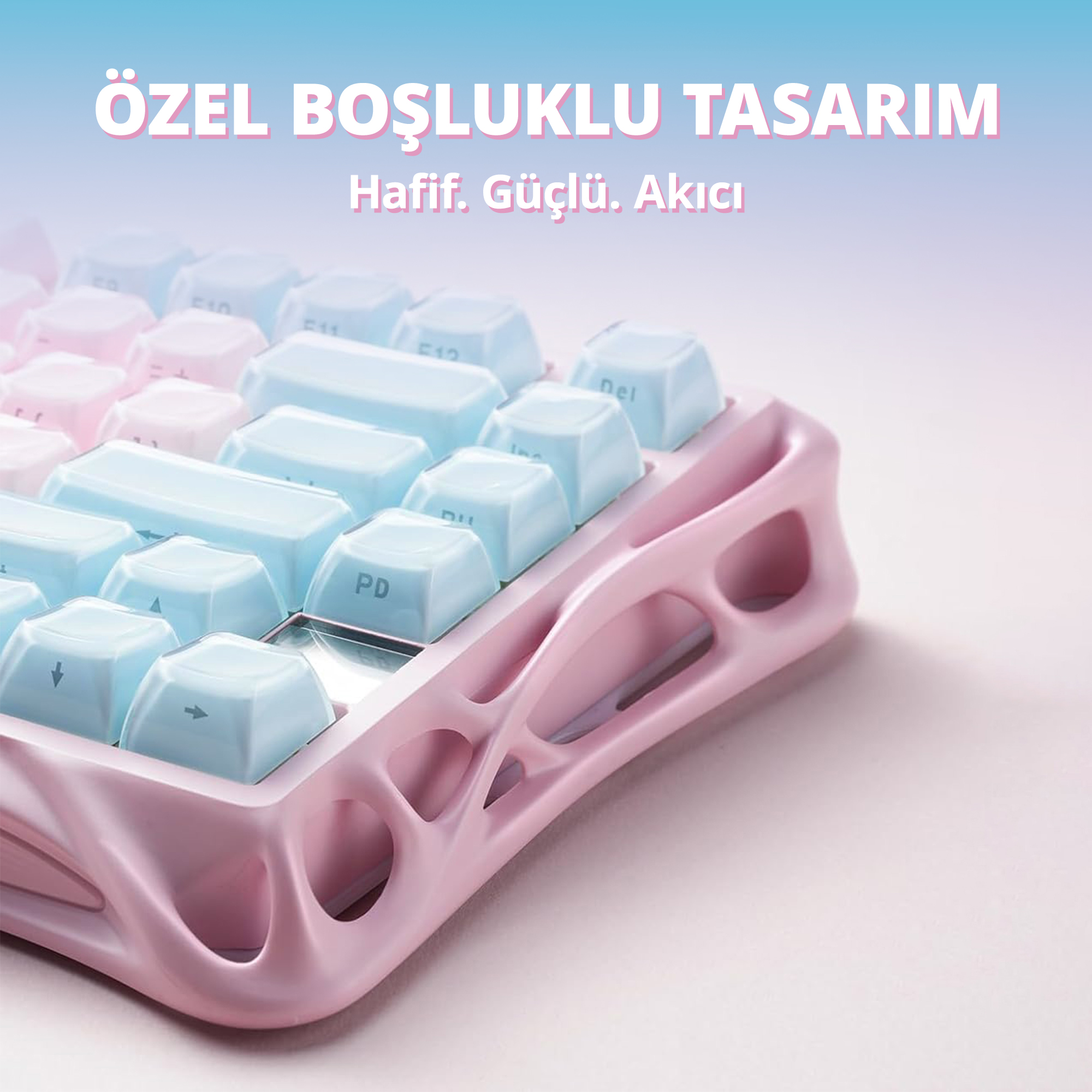 Różowa klawiatura z jasnoniebieskimi klawiszami i otwartym, opływowym wzorem.