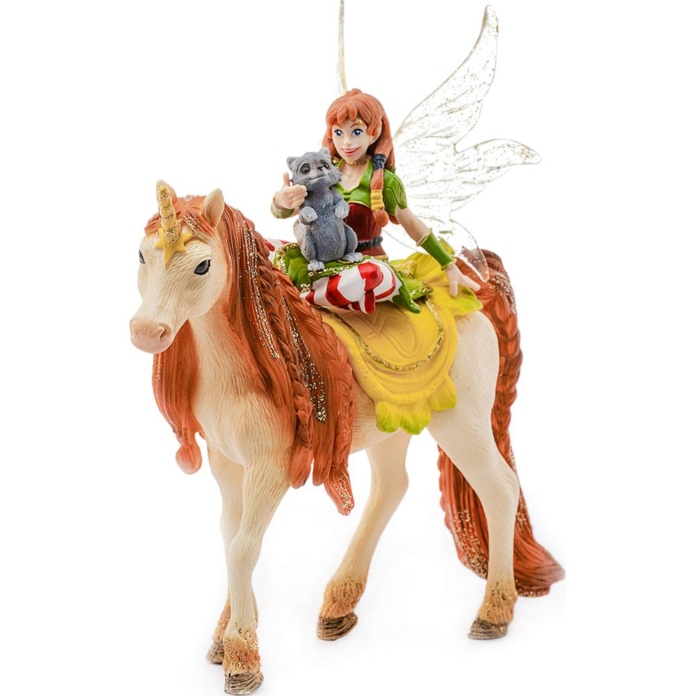 Ruda wr77ka jedzie na jednoro77cu, trzymaj77c szarego kota. Ozdoba.