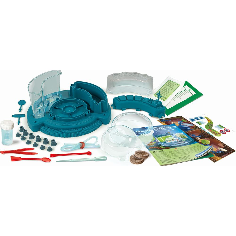 Ein grünes Wissenschafts-Kit mit verschiedenen Teilen, Röhren, Werkzeugen und Anleitungen.