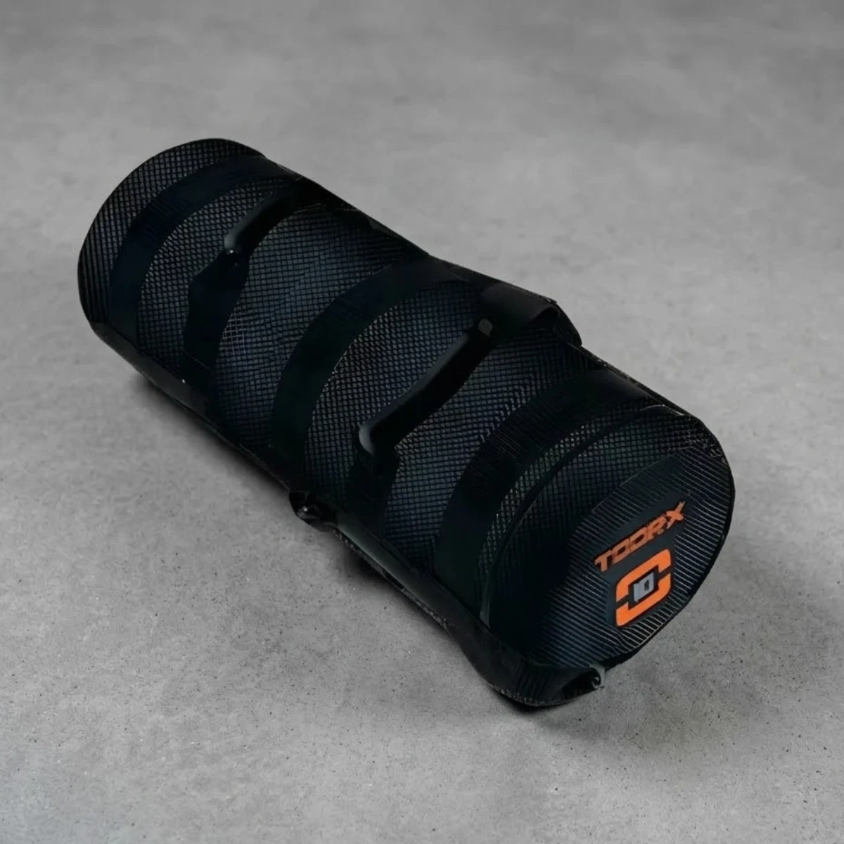Black cylindrical grip with grooves and an orange logo.