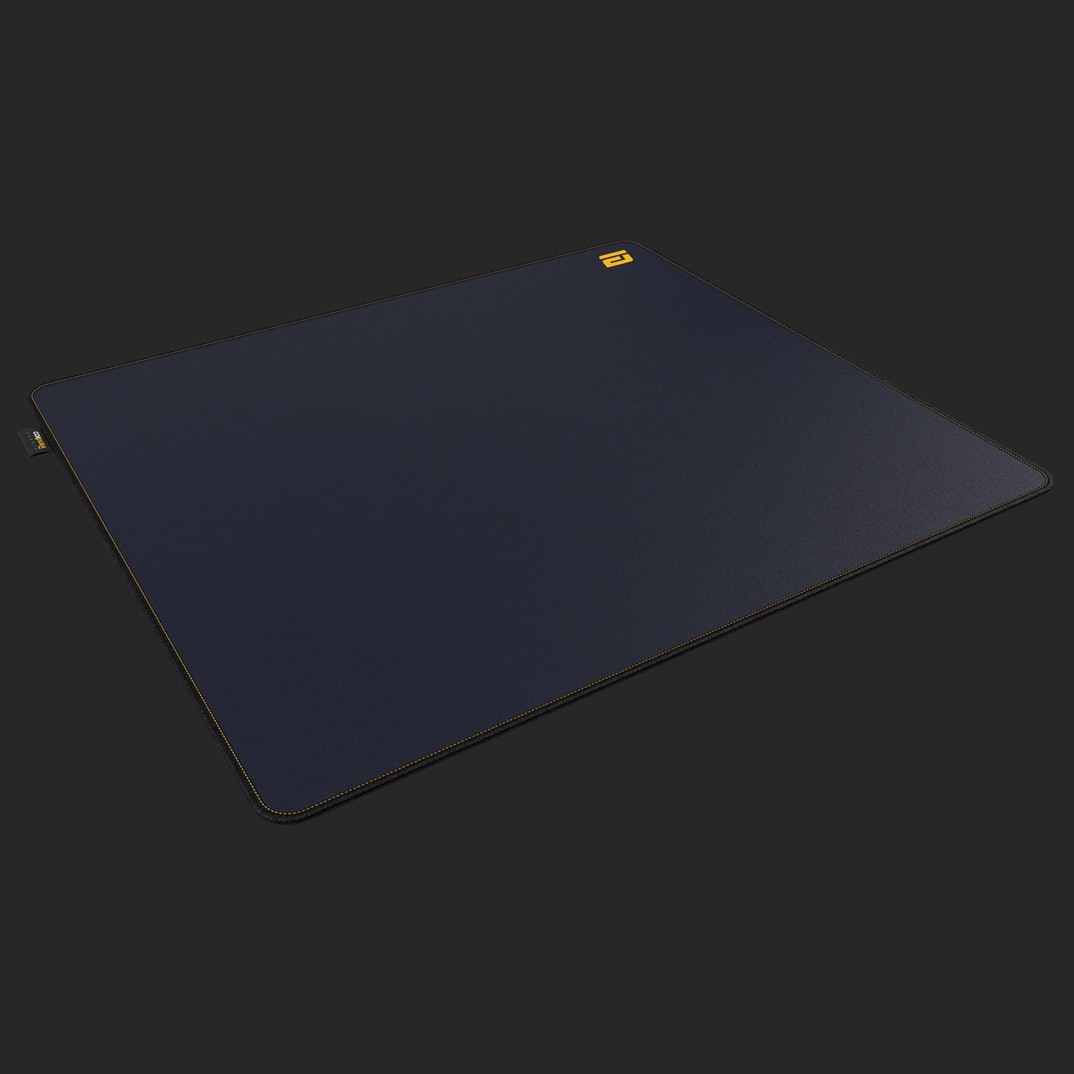 Dark blue mousepad with yellow stitching and logo on a black background.