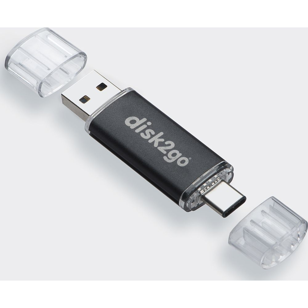 Une clé USB noire avec connecteurs USB-A et USB-C, capuchons à côté.