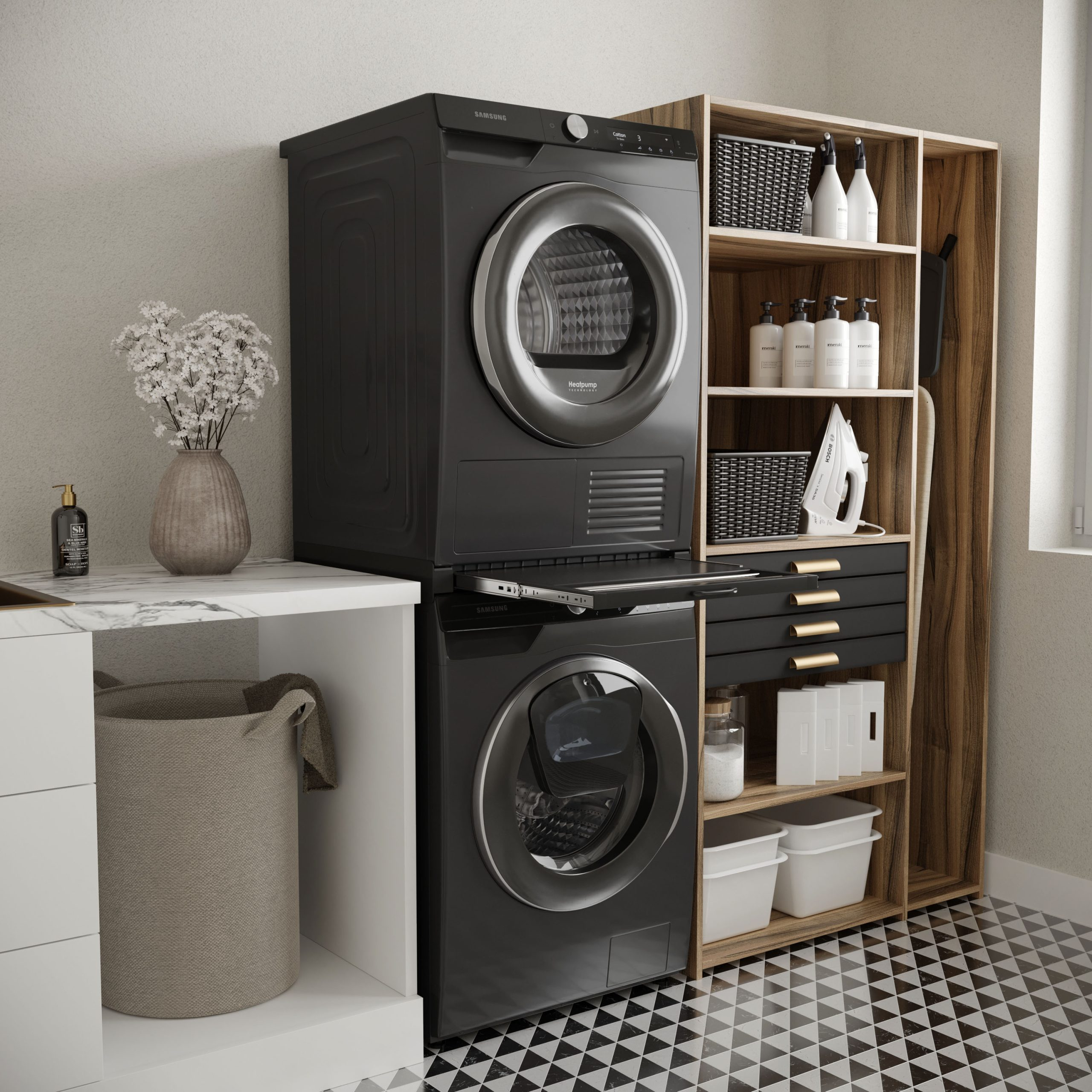 Black washer and dryer with a white basket and flowers.