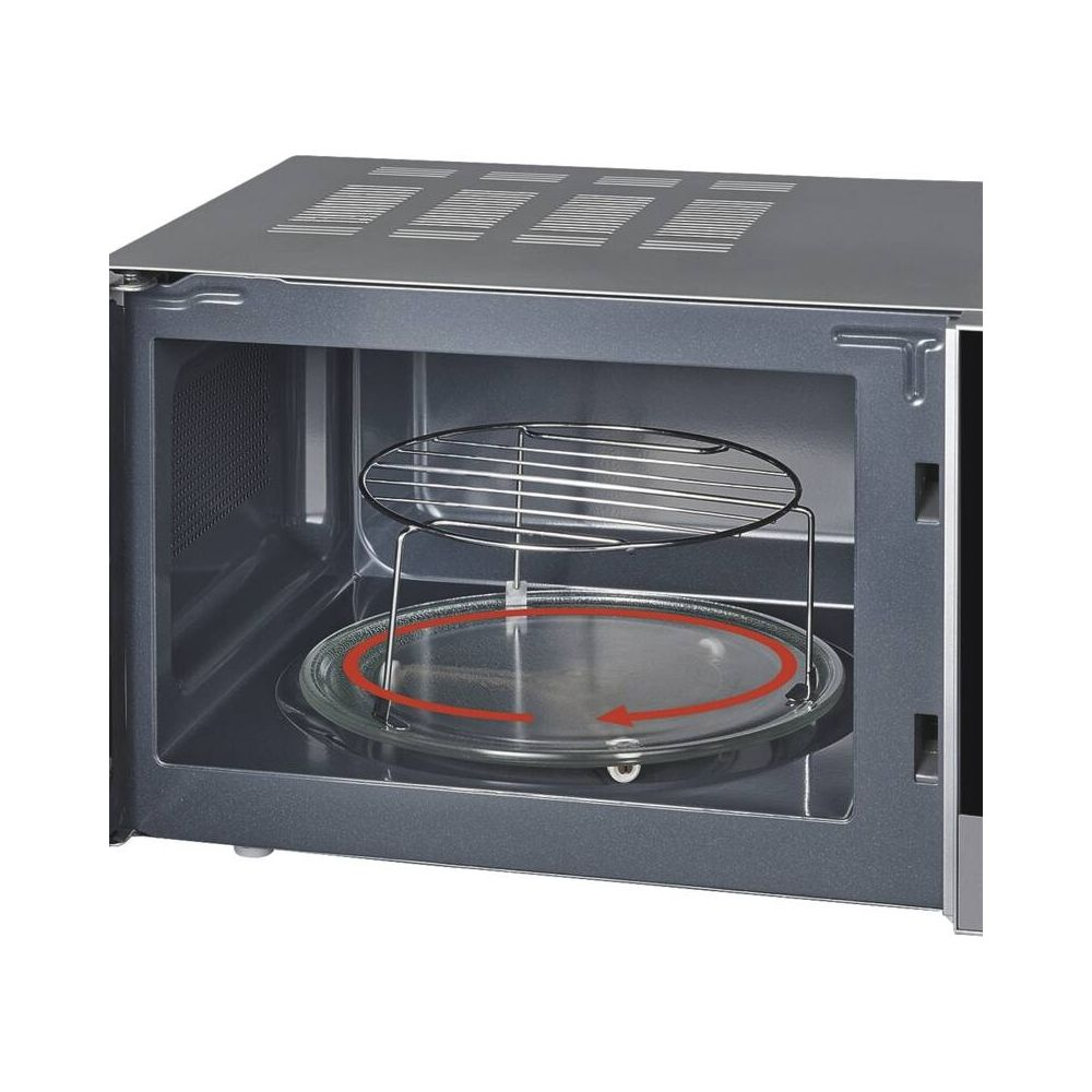 Wnętrze kuchenki mikrofalowej z talerzem obrotowym i rusztem.