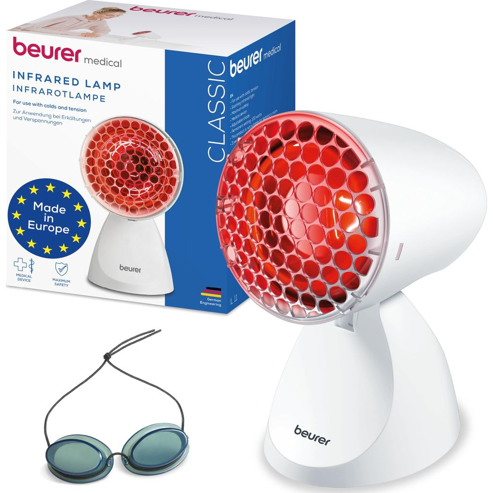 Eine weiße Infrarotlampe mit rotem Licht und Schutzbrille, neben der Verpackung.