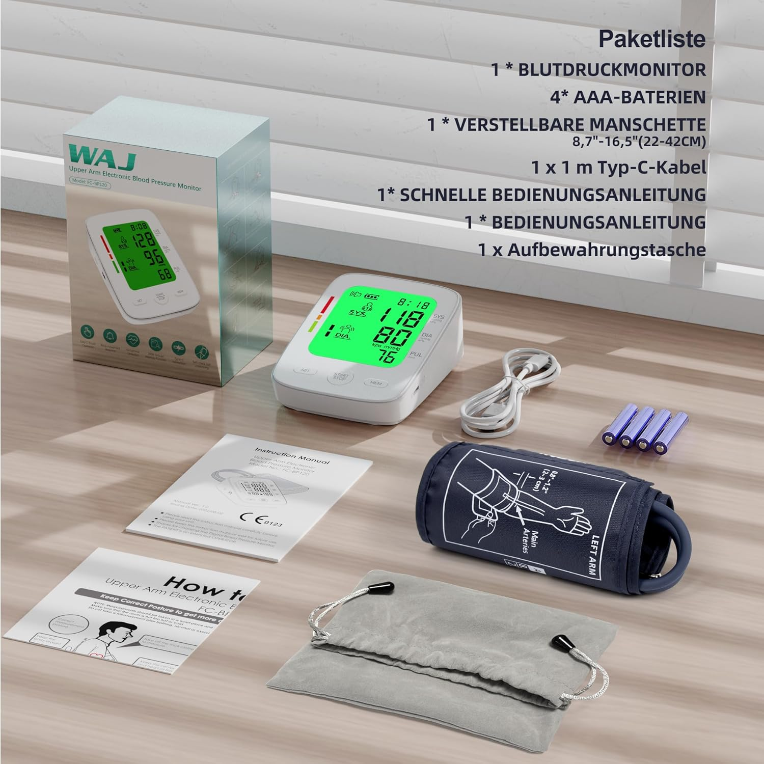 Ein WAJ Oberarm-Blutdruckmessgerät mit Manschette, Kabel, Batterien und Anleitungen.