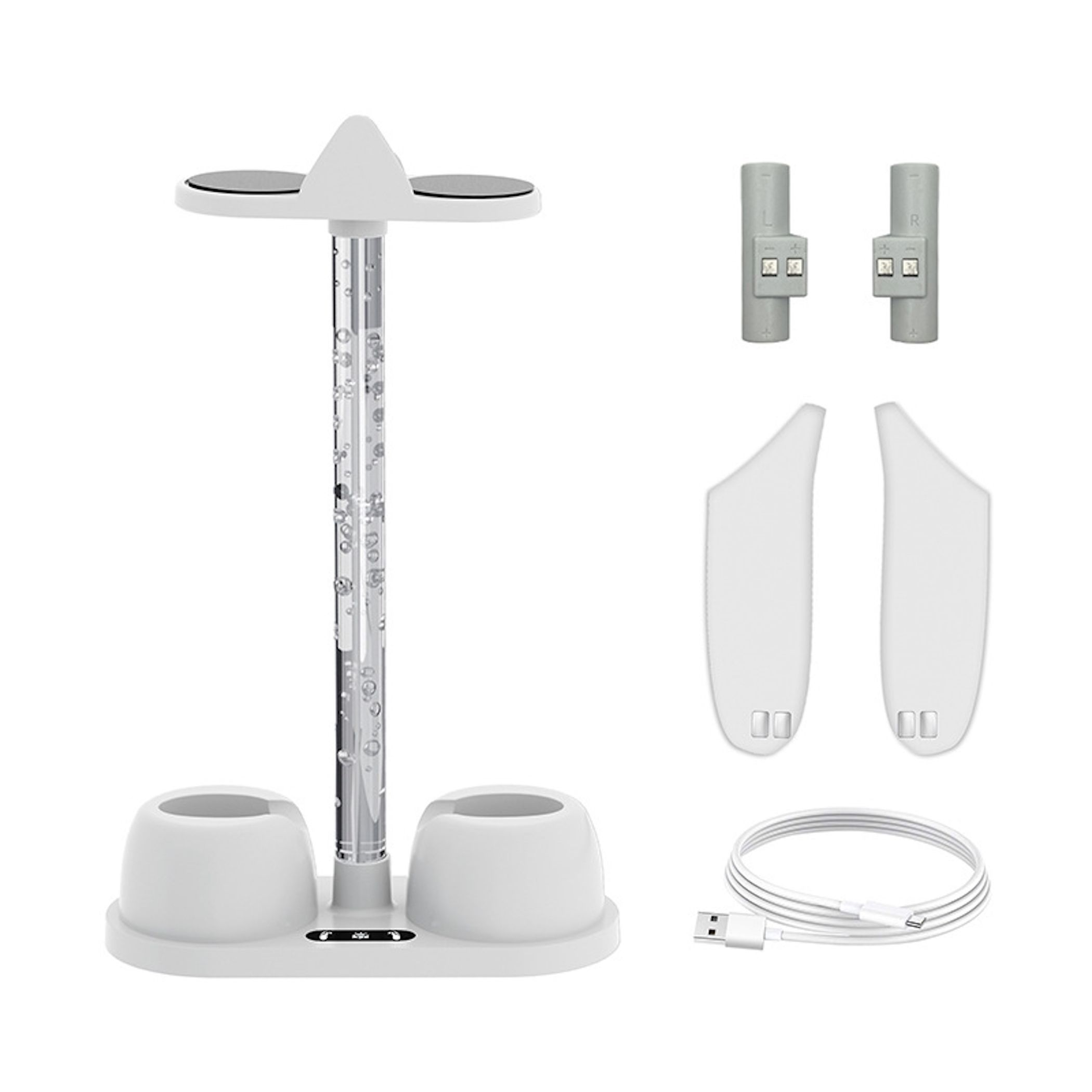 Un supporto di ricarica bianco con accessori, inclusi due connettori grigi e un cavo USB.