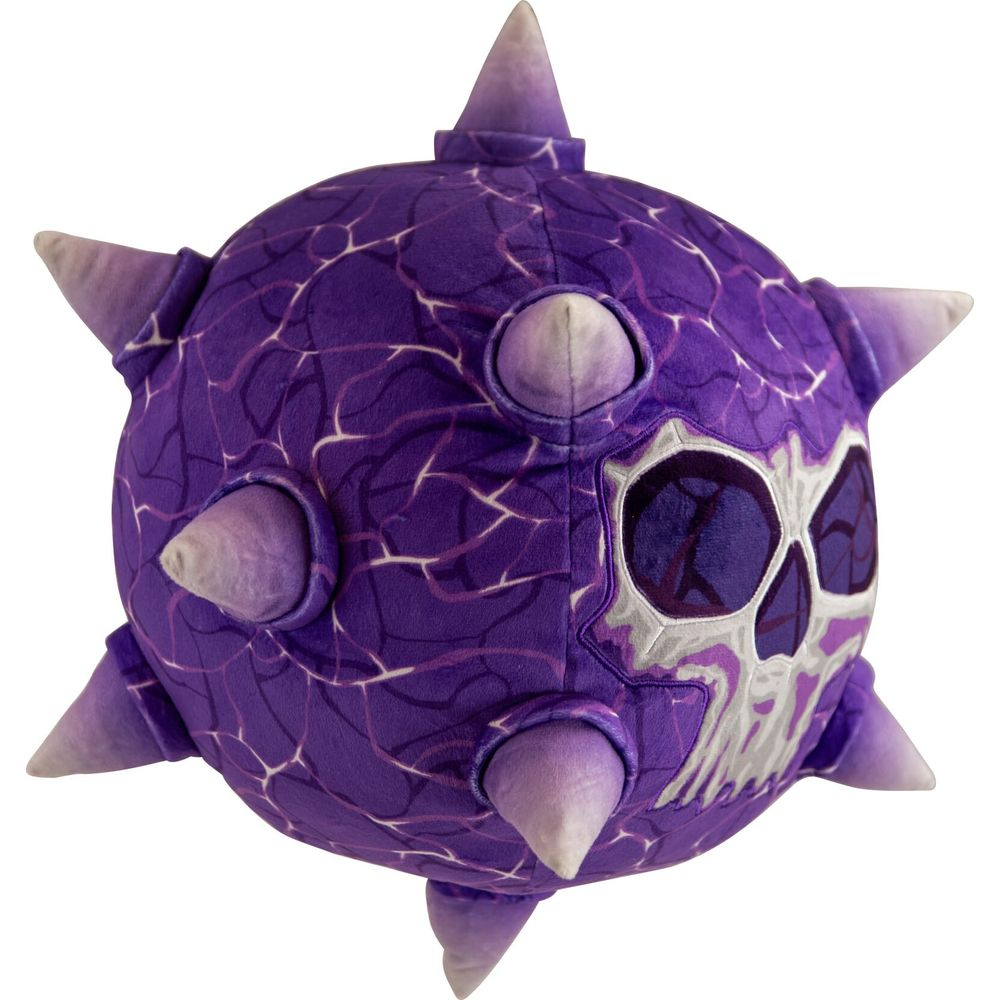 Peluche sferico viola con spuntoni e faccia da teschio.