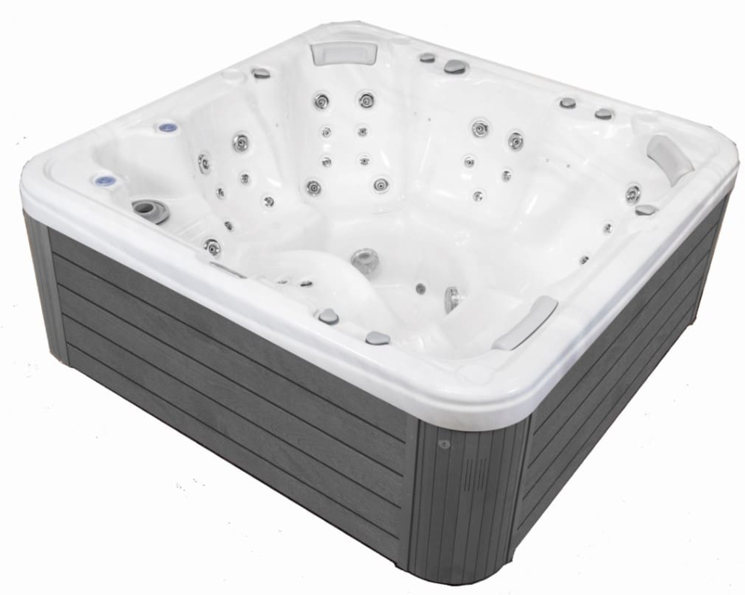 Un jacuzzi blanco con laterales grises y muchos chorros.