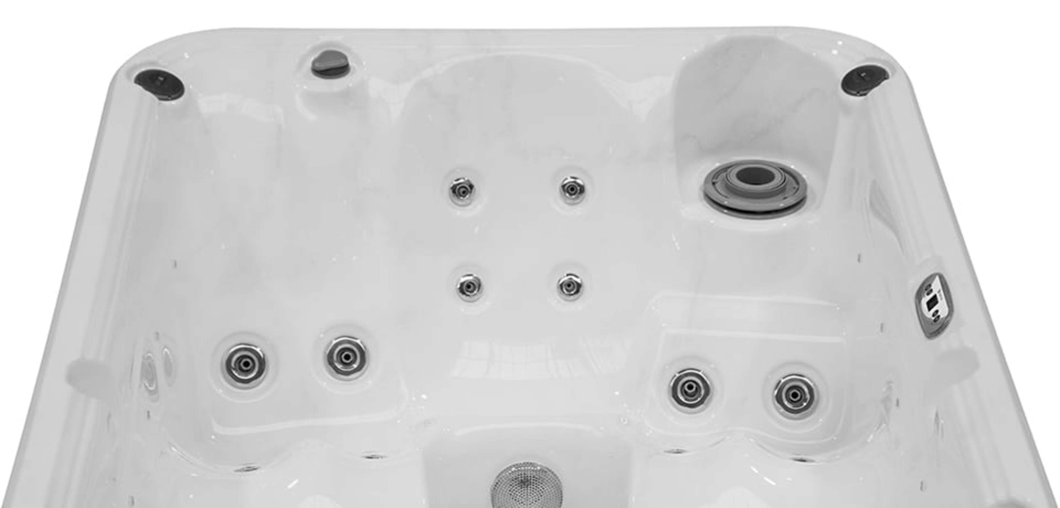 El interior de un jacuzzi blanco con múltiples chorros y un desagüe central.