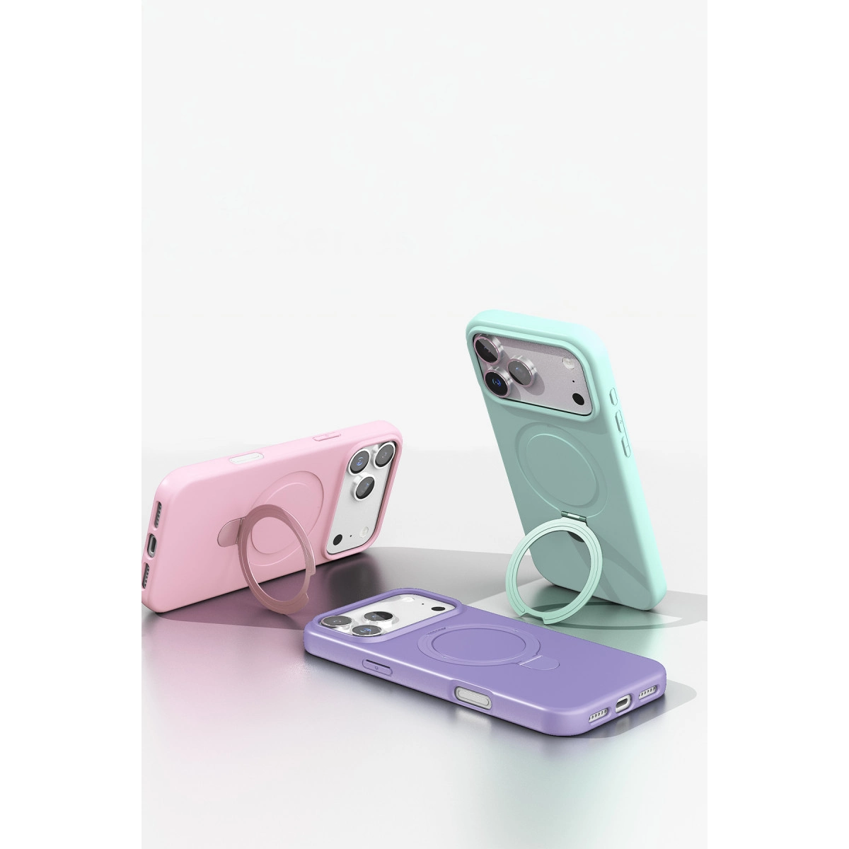 Halka tutuculu pembe, nane yeşili ve mor renkli üç telefon kılıfı.