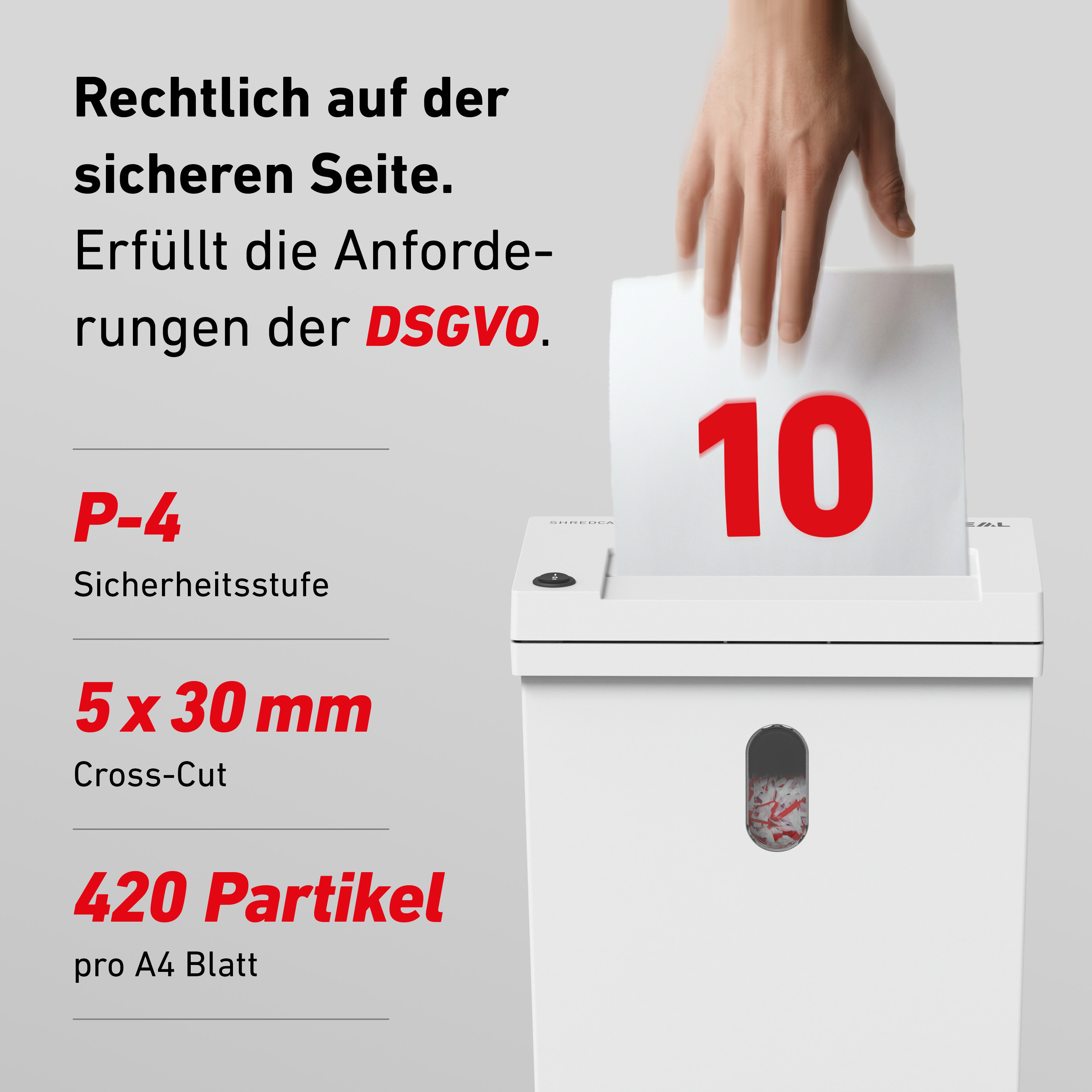 Ein Mann schreddert ein Blatt Papier mit der Zahl 10 auf einem Aktenvernichter.