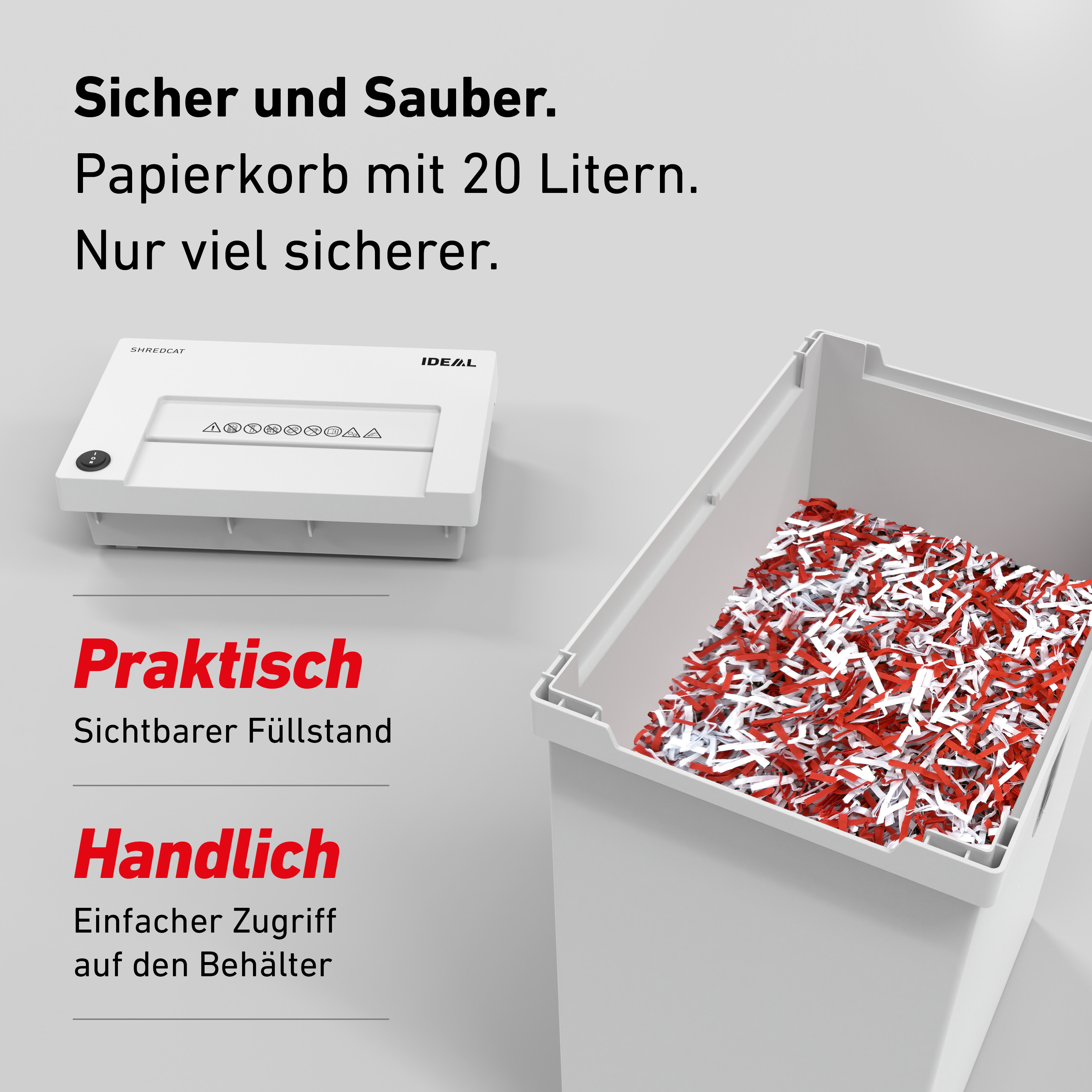 Ein weißer Aktenvernichter neben einem Behälter mit geschreddertem Papier.