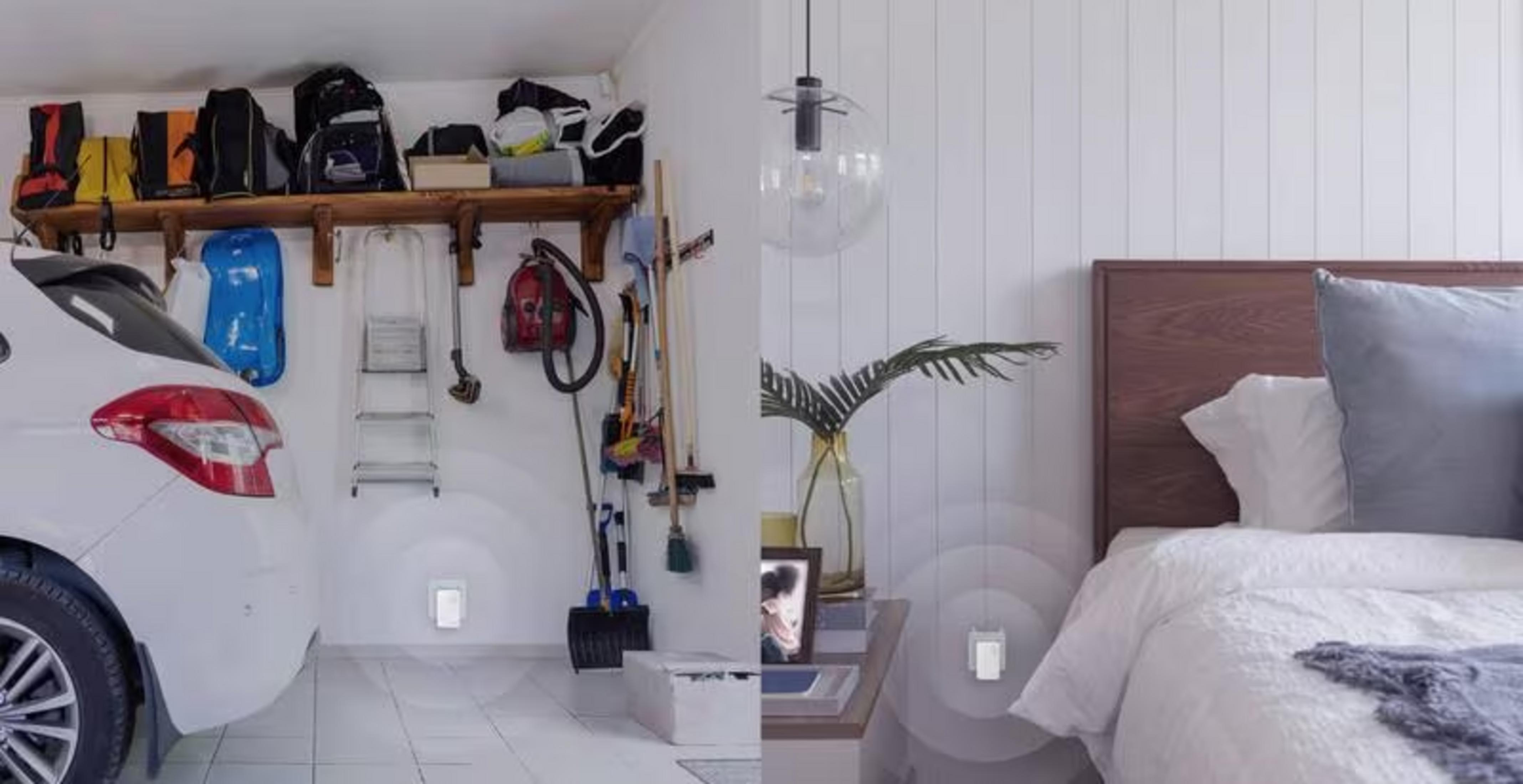 A car in a garage next to tools and a bed with pillows.