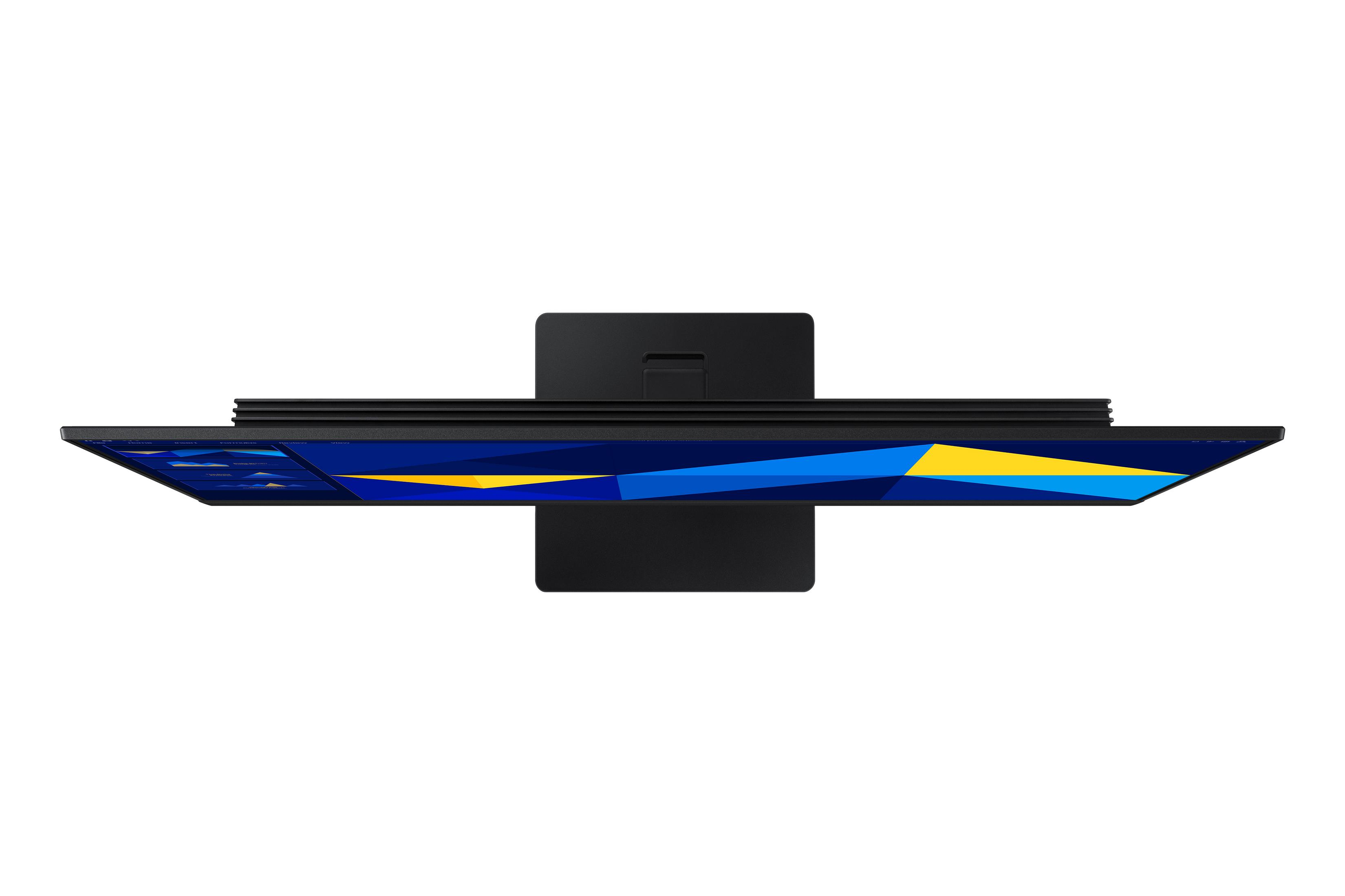 Zwarte monitor met abstracte blauw-gele achtergrond, van bovenaf gezien.