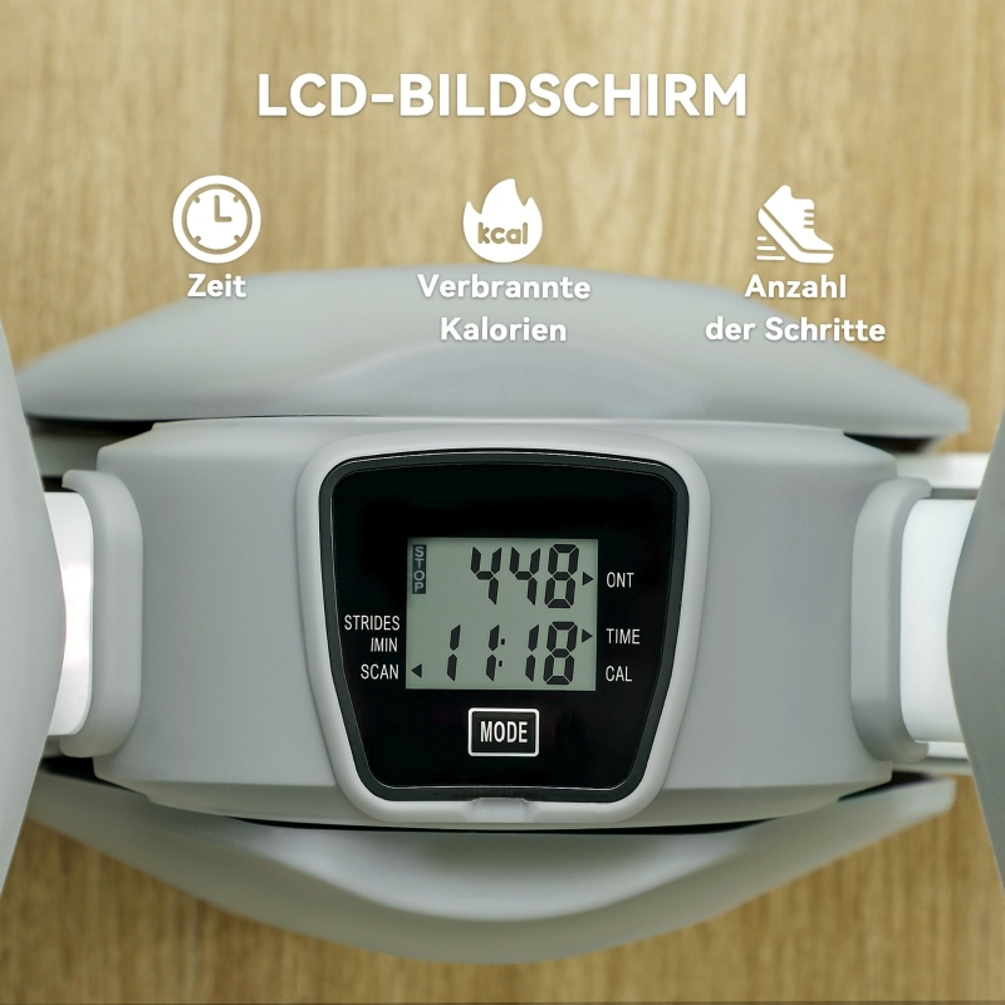Ein graues Trainingsgerät mit einem LCD-Bildschirm, der Zeit, verbrannte Kalorien und Schritte anzeigt.