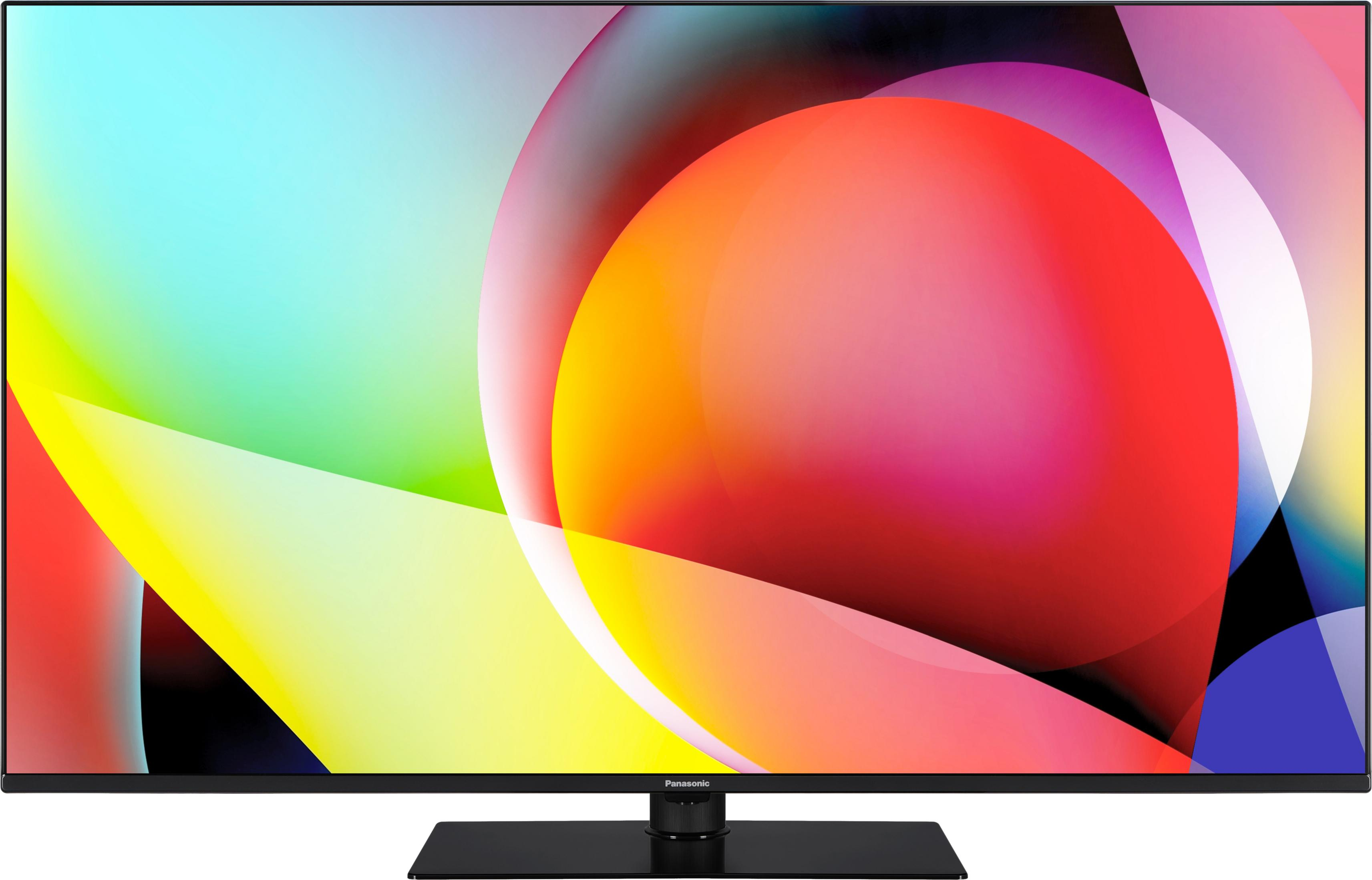 Un televisore moderno con uno sfondo astratto e colorato.