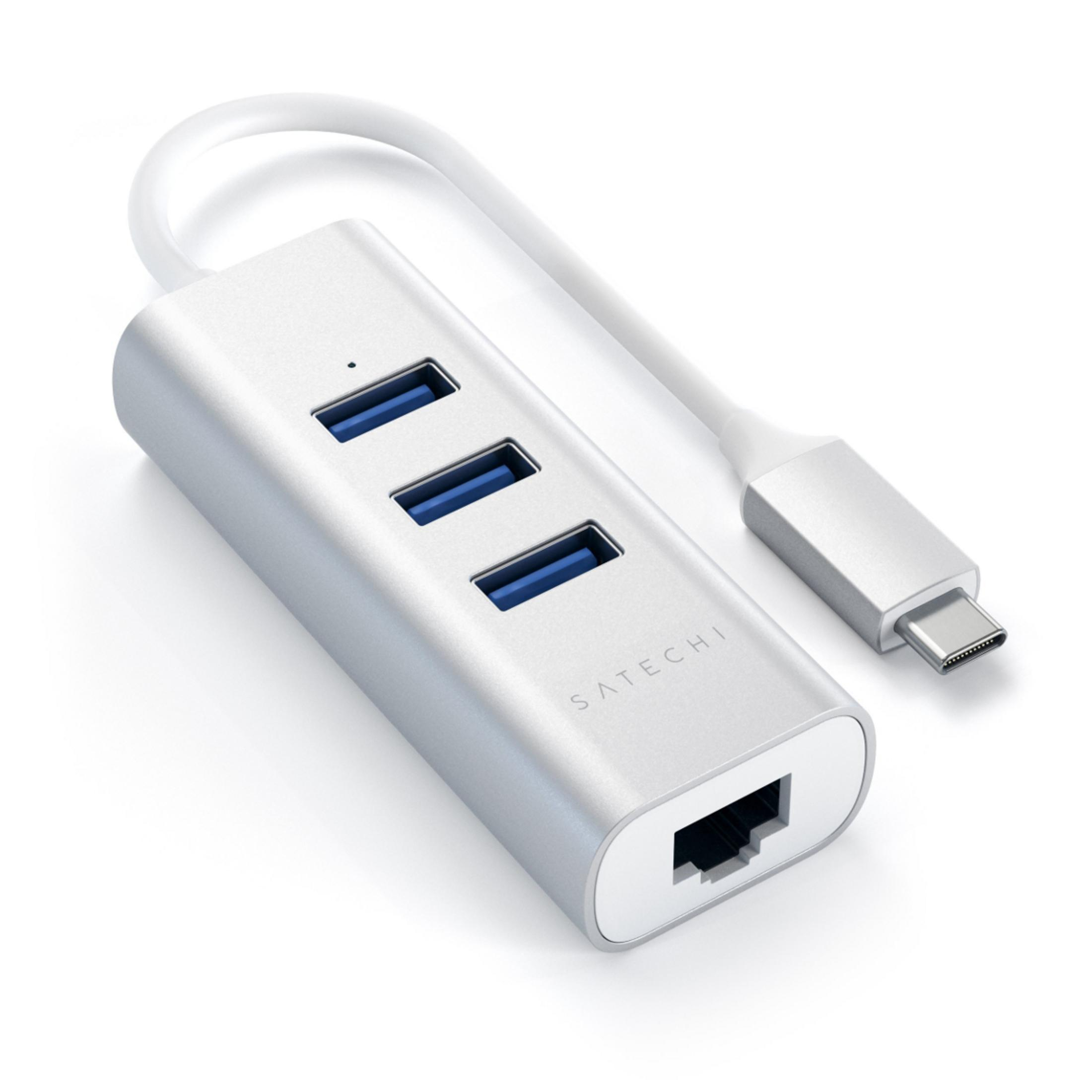 Hub USB-C argentato con tre porte USB-A e una porta Ethernet.