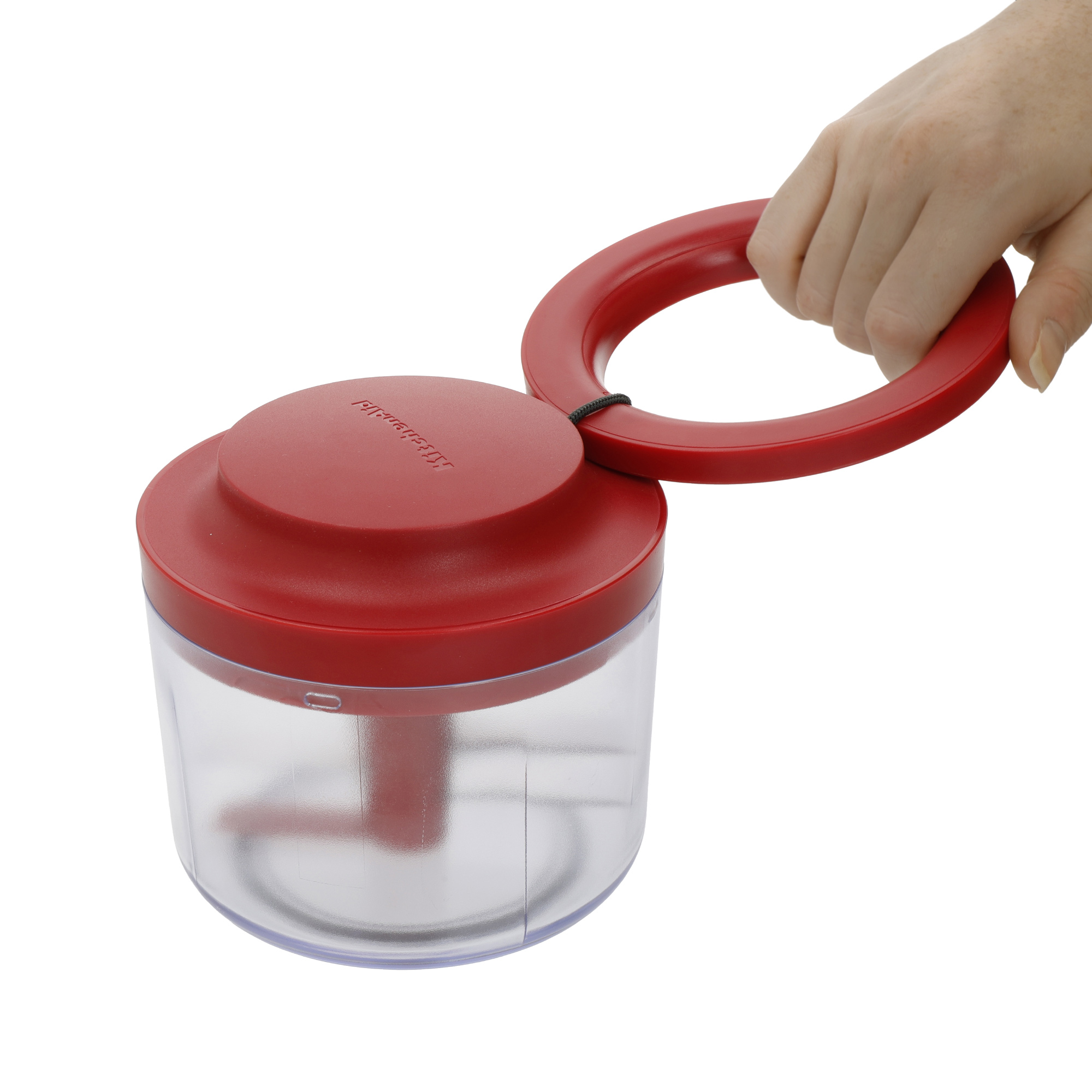 Rote Küchenmaschine mit transparentem Behälter, von Hand gehalten.