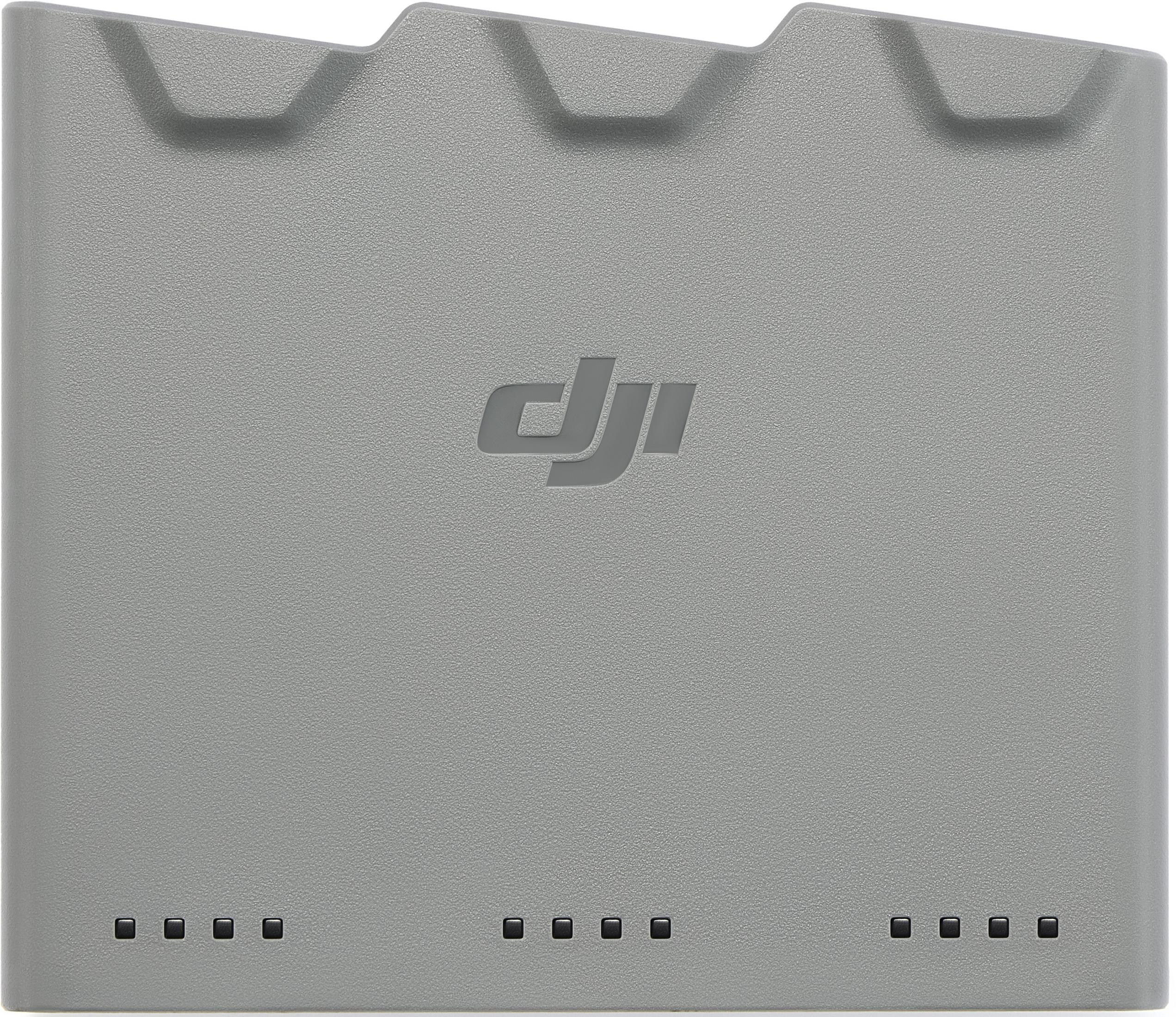 Cargador DJI gris con cuatro indicadores de carga abajo.