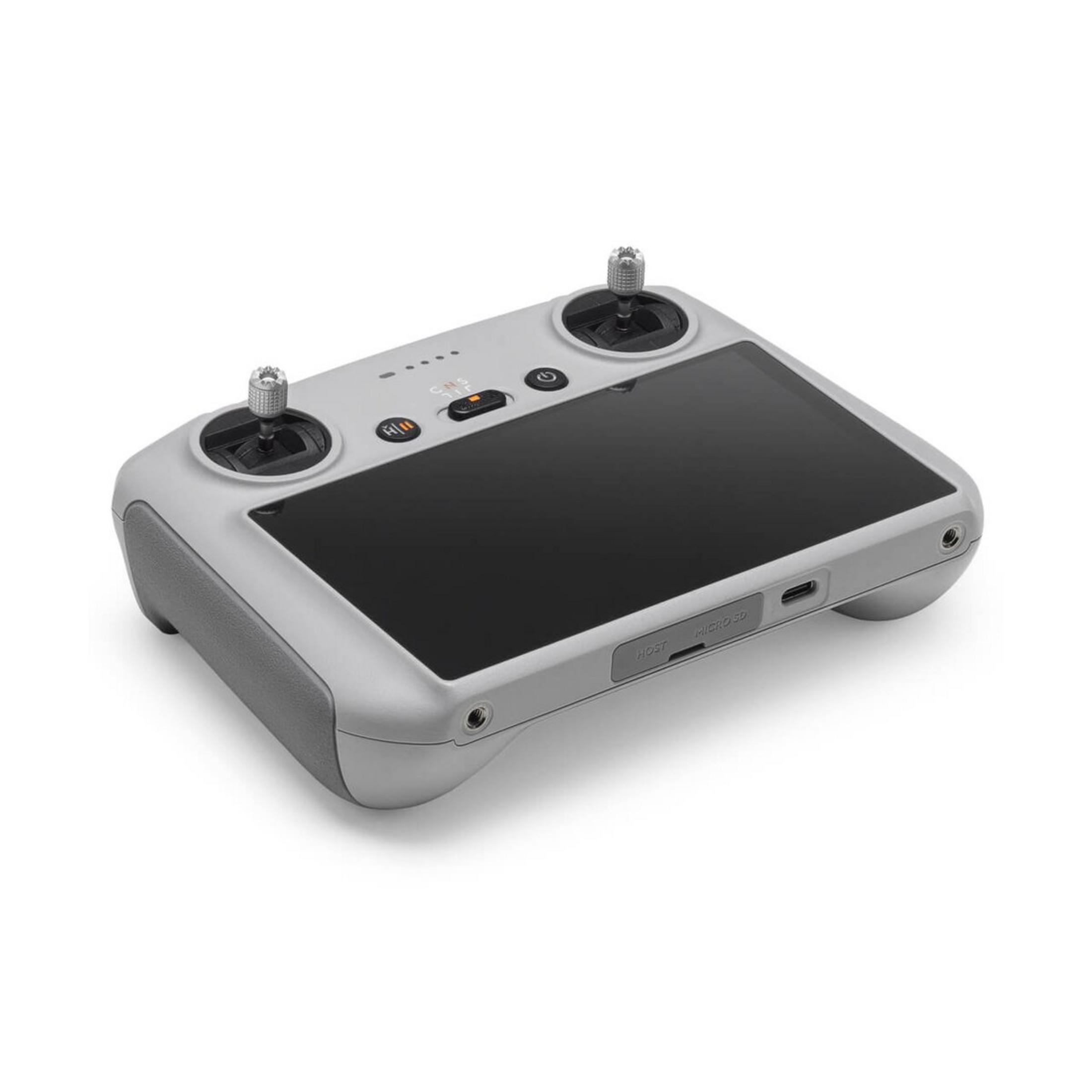 Controlador RC gris con dos joysticks, pantalla y puertos.