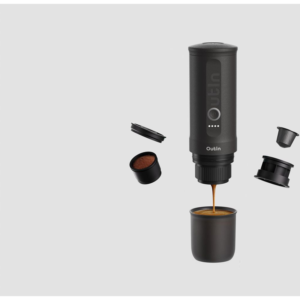 Czarna ekspres do kawy z fusami i kroplą kawy.