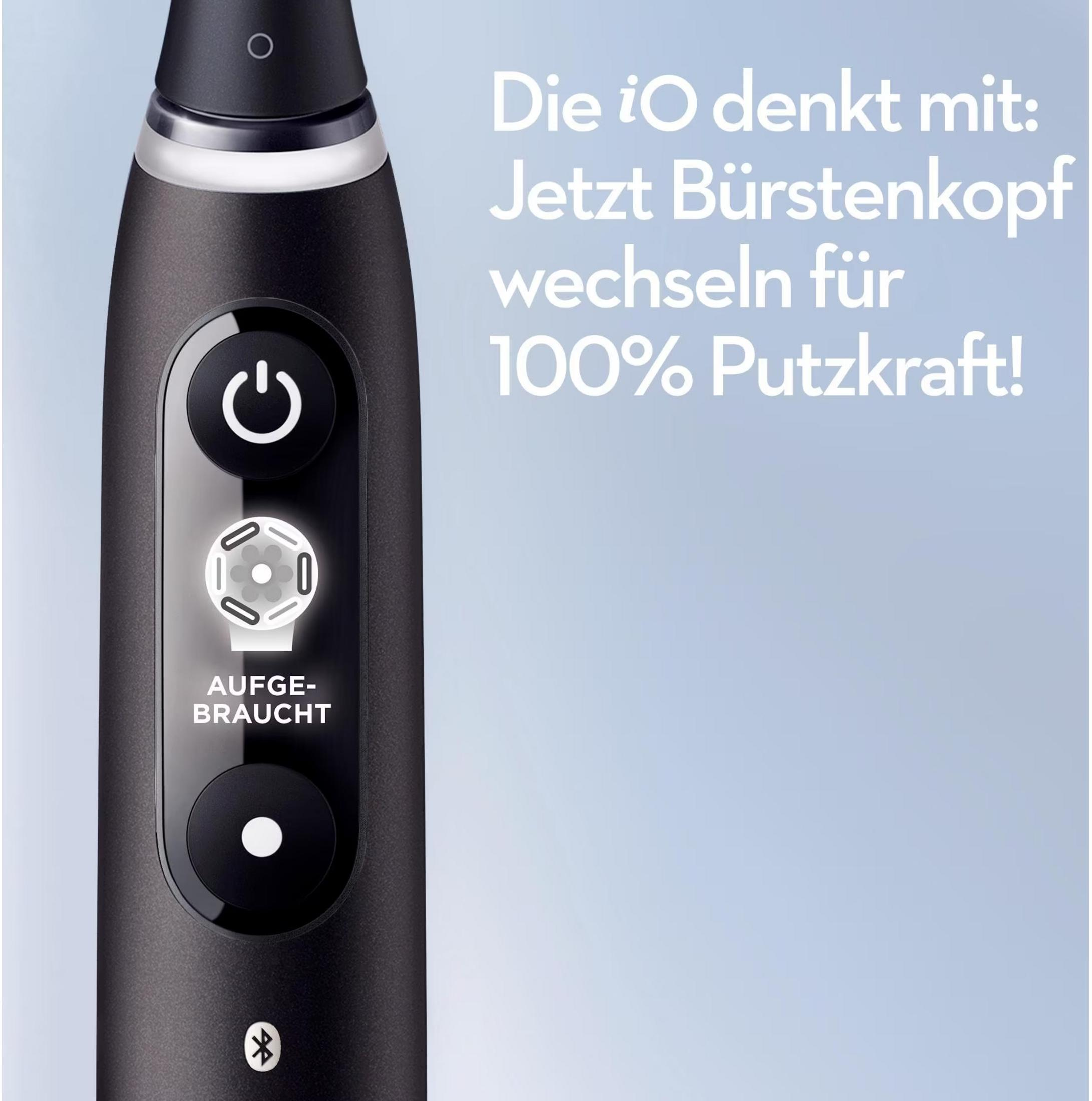 Czarna szczoteczka elektryczna z przyciskiem zasilania i wskaźnikiem 'Zużyto'.